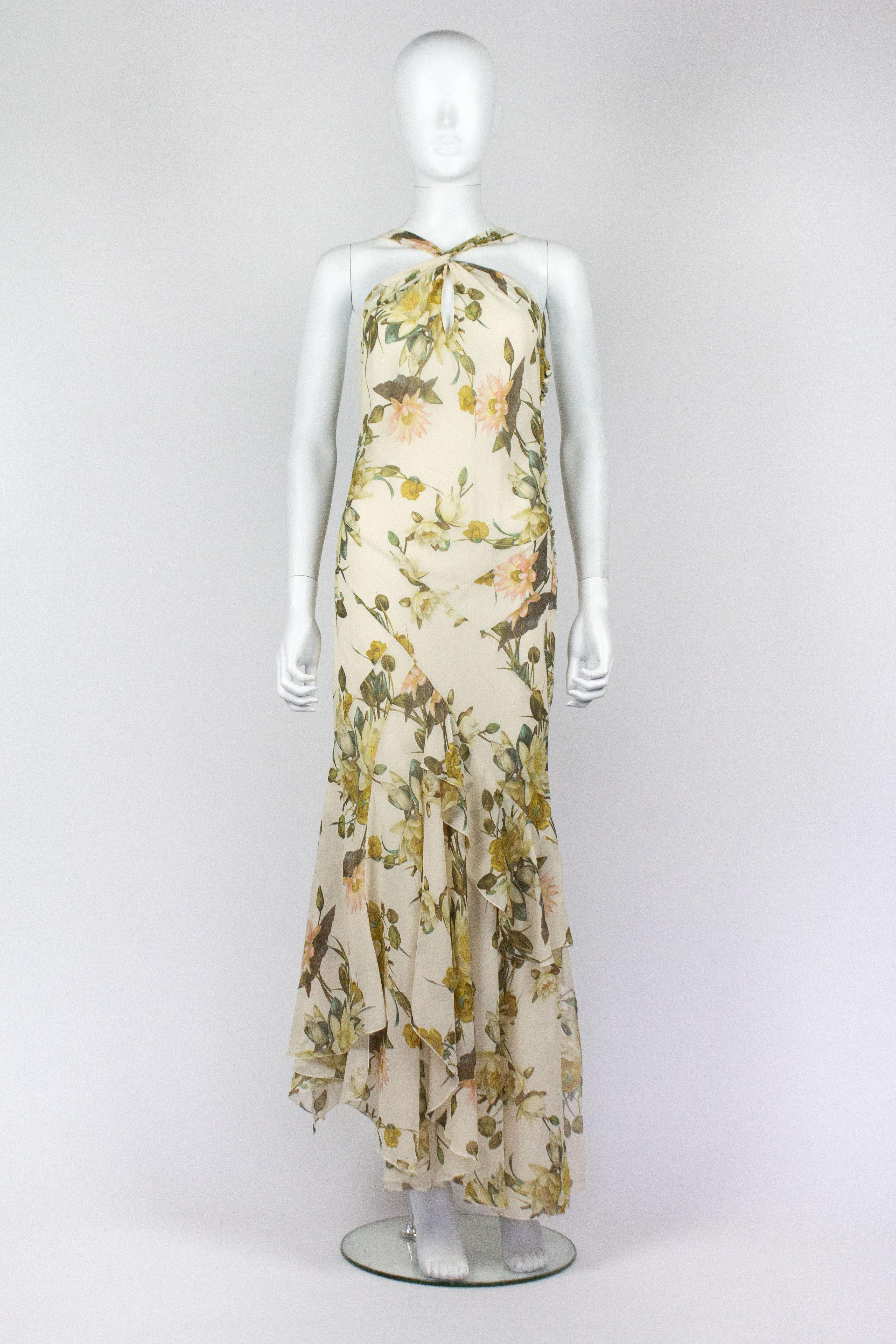 Christian Dior by John Galliano Spring/Summer 2005 silk floral dress with matching shawl. Exquisite construction with asymmetrical layers of silk chiffon on the skirt, which creates beautiful movement when worn. Fabric covered button fastenings to