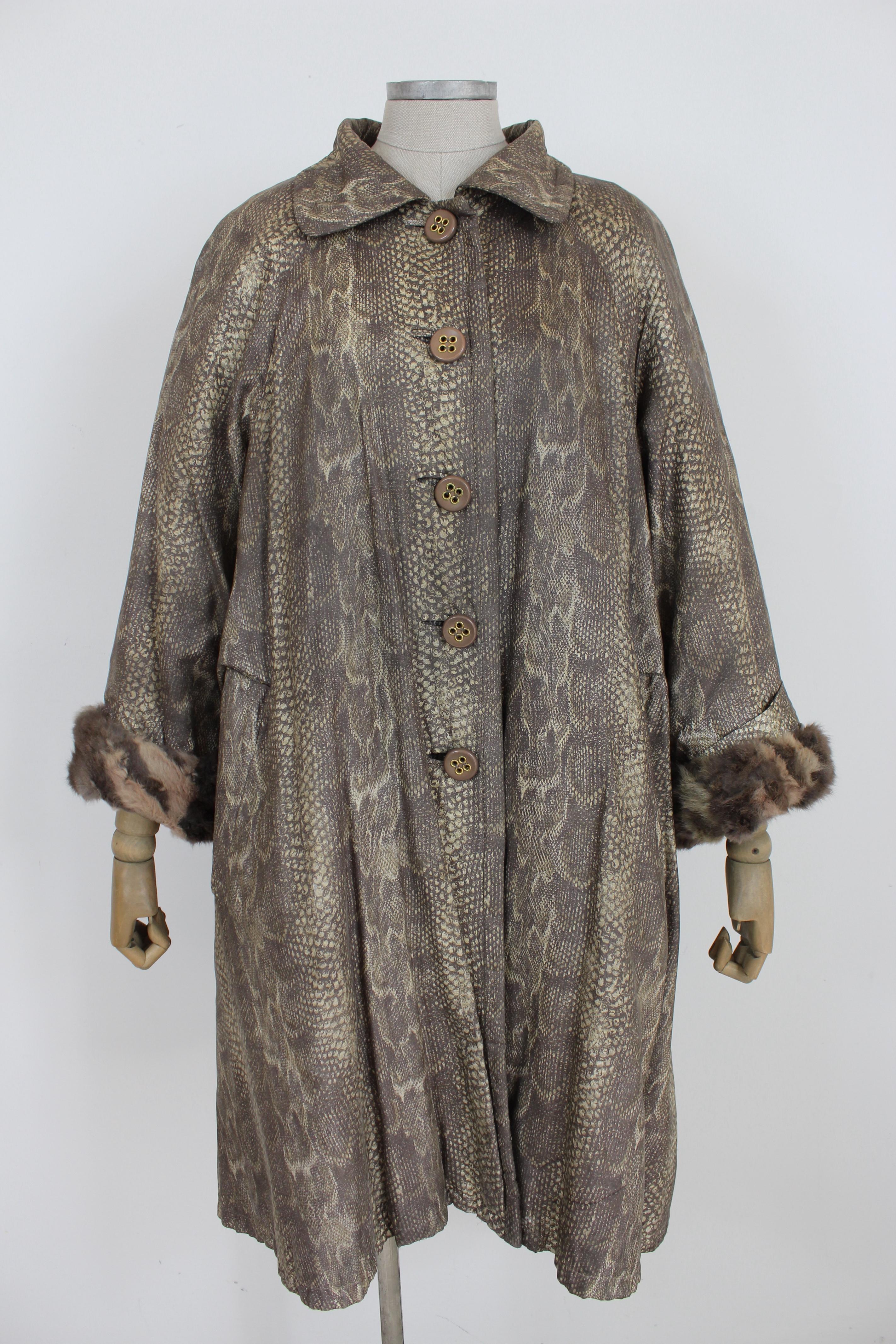 Christian Dior Boutique Fourrure vintage 80s coat with mink fur insert. The coat has the outer part in fabric with crocodile animal print, the inner fur is removable with concealed buttons. So it will be possible to use it for cold or mild