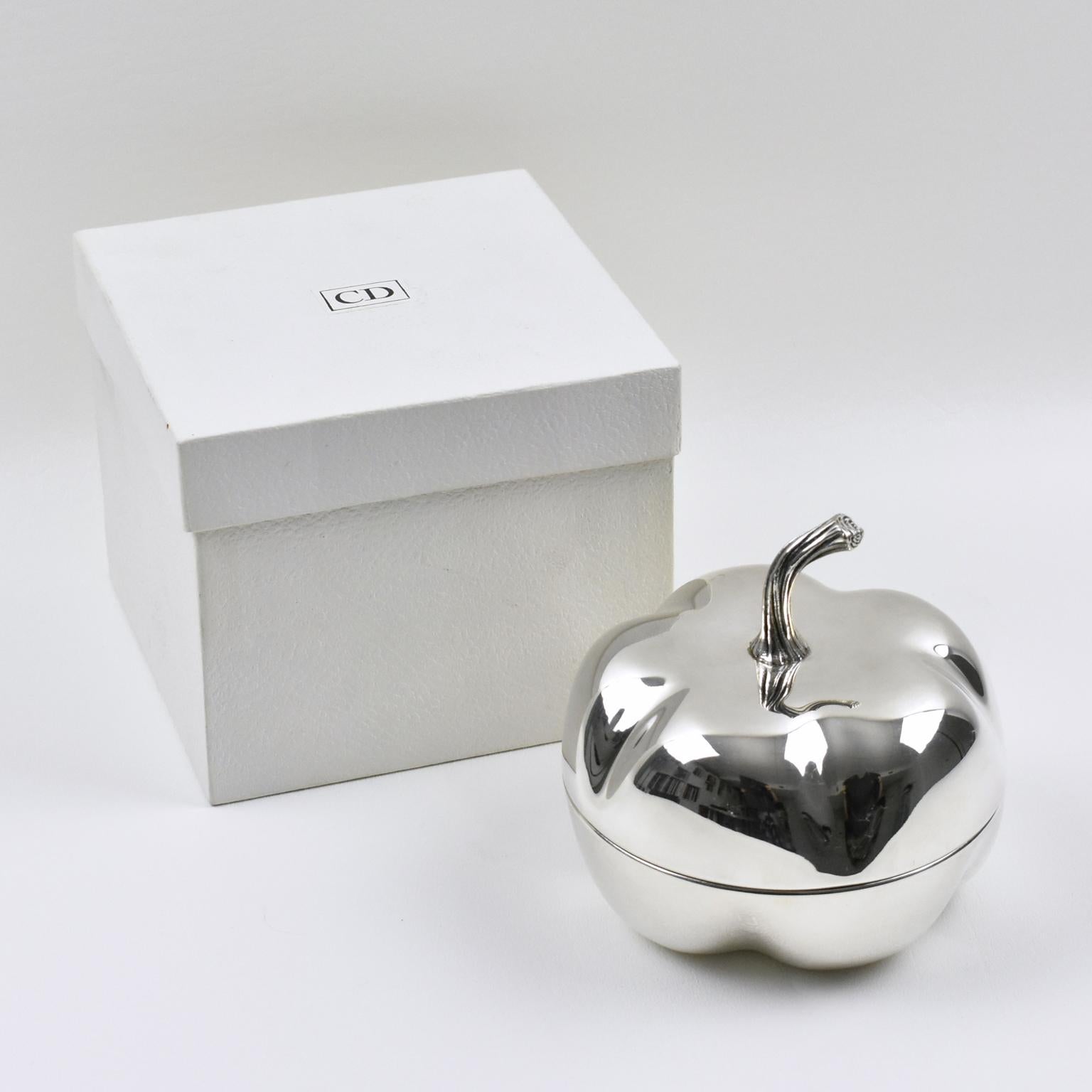 Elegant pumpkin shaped decorative box designed by Christian Dior for his 1970s Home collection. This lovely decorative lidded box is made of silver plated metal with nicely shaped design. Marked underside and engraved on side 'Christian Dior'.
Will