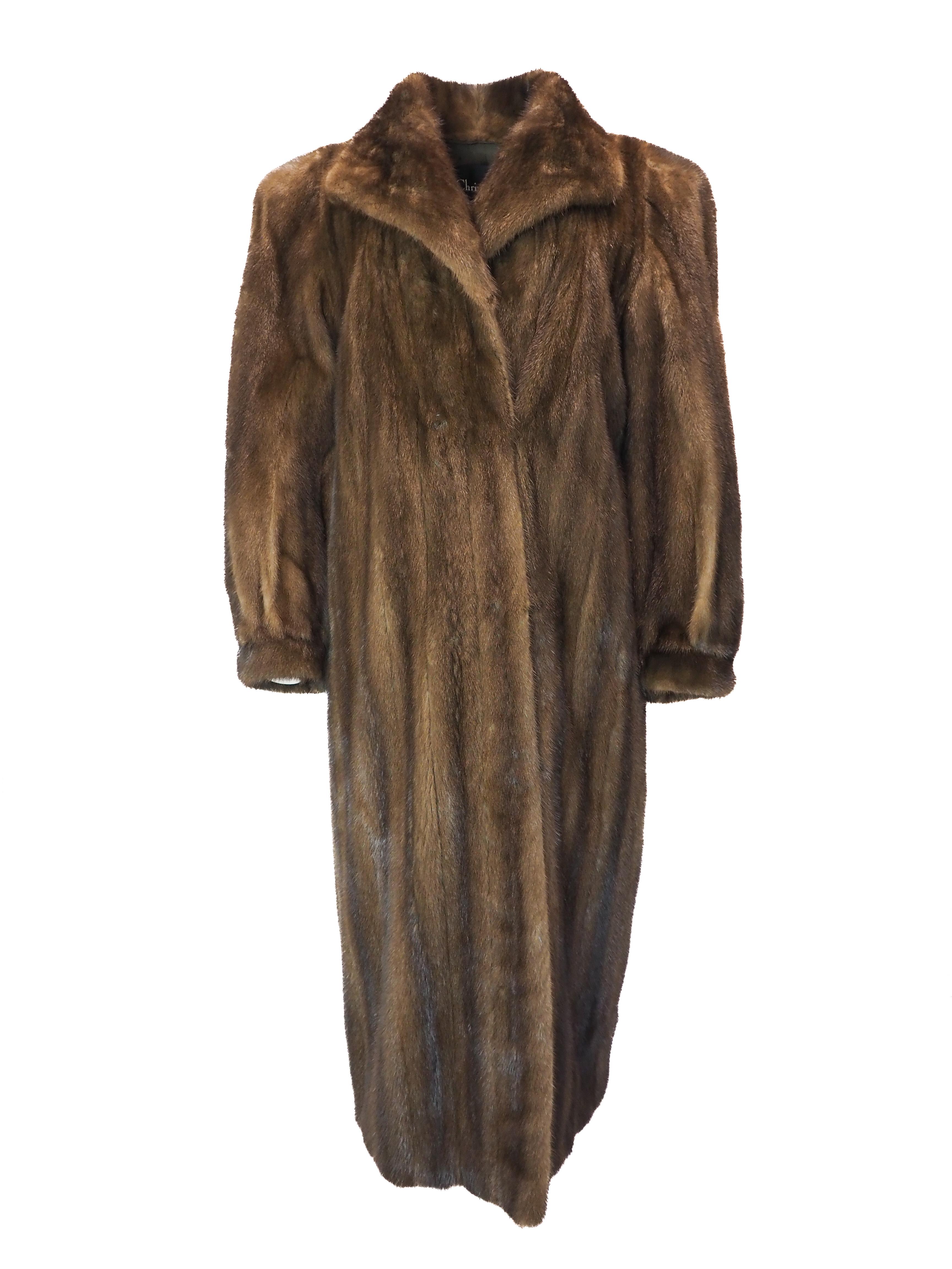 Wrapped in the ultimate expression of refined elegance, this Christian Dior full-length mink fur coat commands attention with its luxurious drape and sumptuous texture. Designed for the discerning woman, it pairs effortlessly with heels for formal