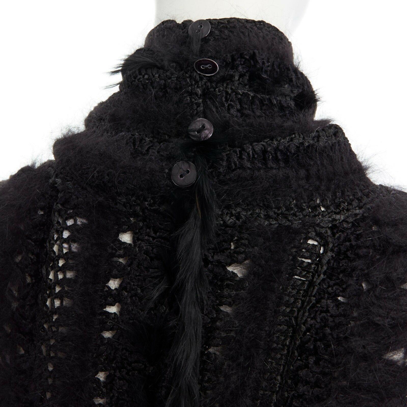 CHRISTIAN DIOR GALLIANO black wool sheer lace fur trimmed crochet knit swaeter L
CHRISTIAN DIOR BY JOHN GALLIANO
Black. 
Knitted. 
Mixed fabric. 
Crochet knit with various fabrics. 
Floral lace and rabbit fur insert. 
Stand funnel collar. 
Button
