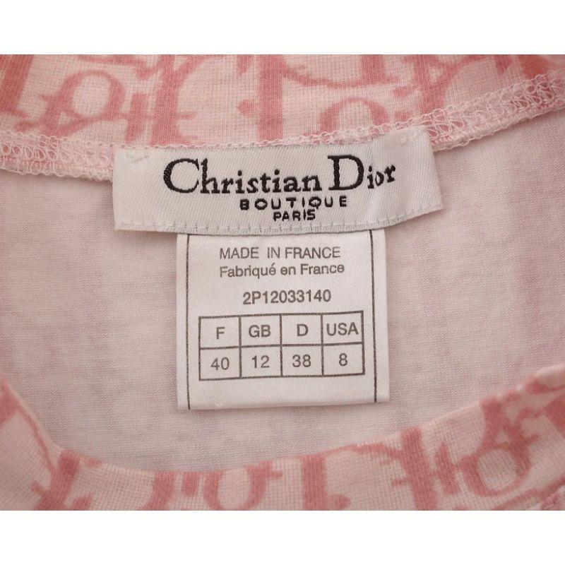 2000's Christian Dior Galliano Era Girly Trotter T-shirt in a pink colour way with short sleeves and number 1 diamanté appliqué on both the front and the back. 

Features:
Iconic Dior 'Girly' Collection
Short sleeves
Rounded neckline
Stretchy