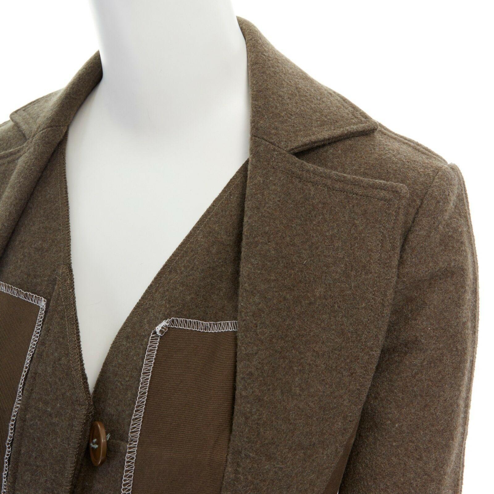 CHRISTIAN DIOR Galliano green reverse constructed exposed seams jacket FR36 S
CHRISTIAN DIOR by JOHN GALLIANO
Wool, alpaca, cotton, metal. 
Khaki green. 
Reversed constructed jacket. 
Contrast white stitched seams. 
Patchwork detail. 
Button front
