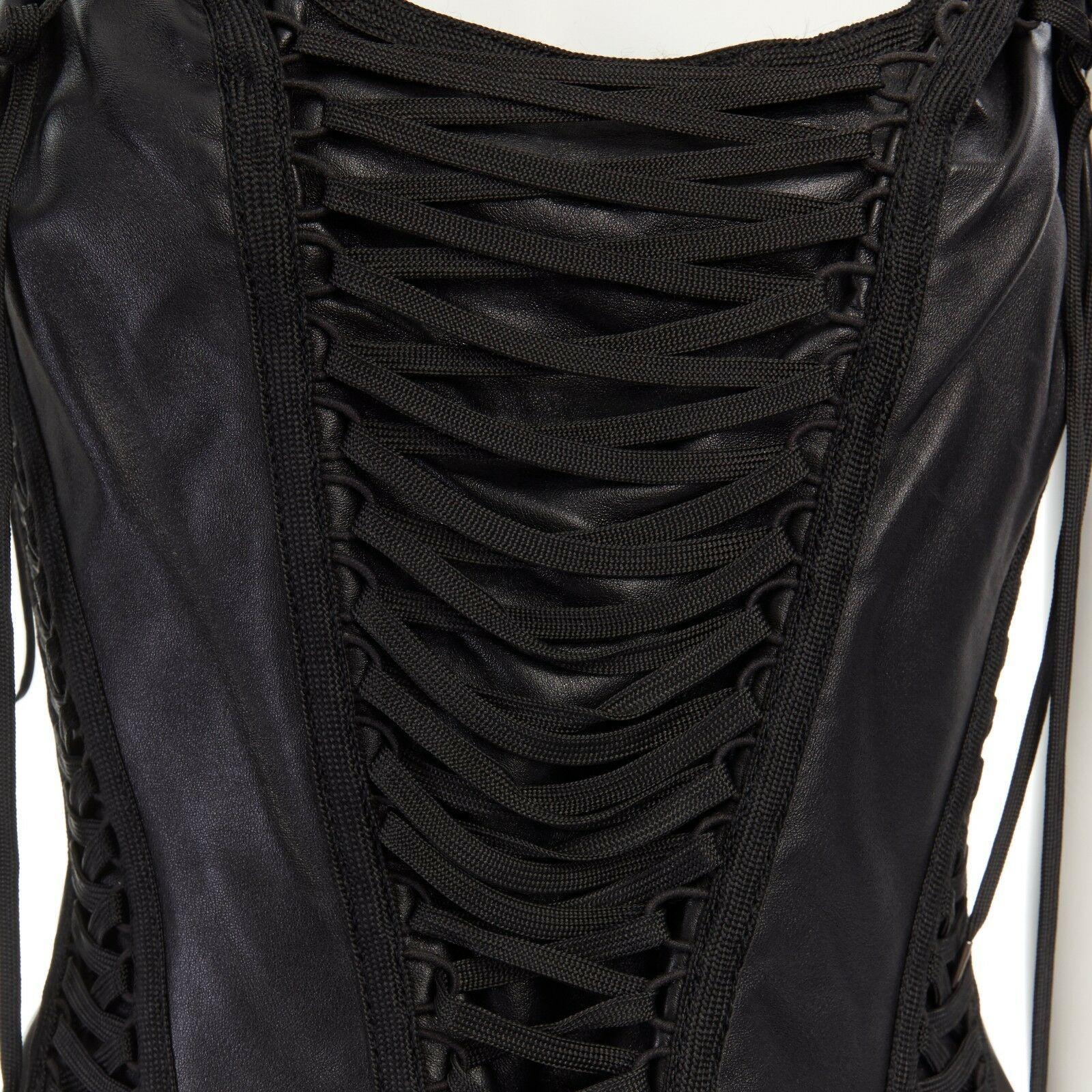CHRISTIAN DIOR GALLIANO Vintage black leather laced corset vest top FR42 L
CHRISTIAN DIOR BY JOHN GALLIANO
Black leather upper. Corset-inspired. 
Lace up detail throughout. Scoop neck. Sleeveless. 
Side zip closure. Fully lined. 
Made in