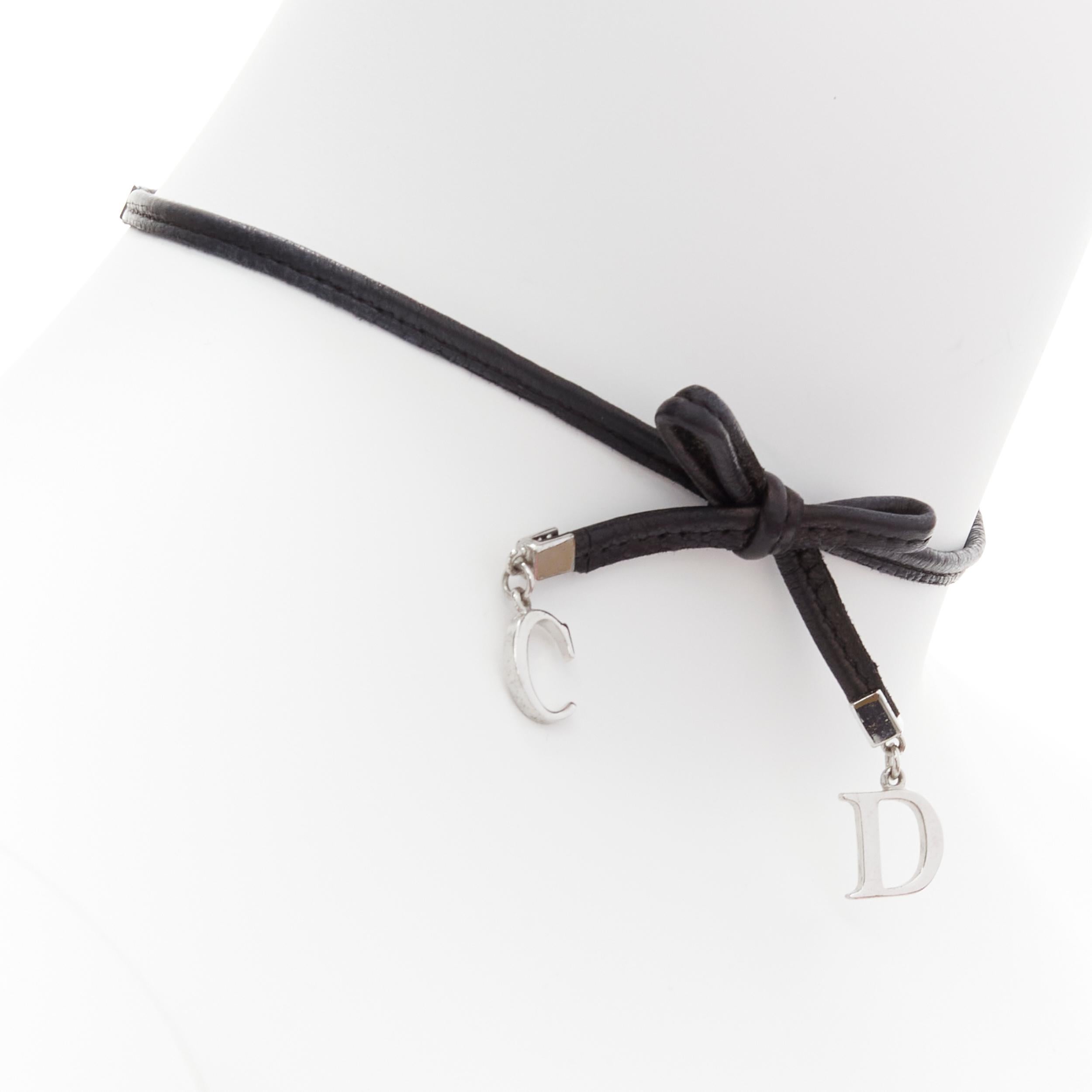 CHRISTIAN DIOR Galliano Vintage CD logo leather bow punk choker necklace
Reference: TGAS/C02037
Brand: Christian Dior
Designer: John Galliano
Material: Leather, Metal
Color: Black, Silver
Pattern: Solid
Closure: Hook & Bar

CONDITION:
Condition: