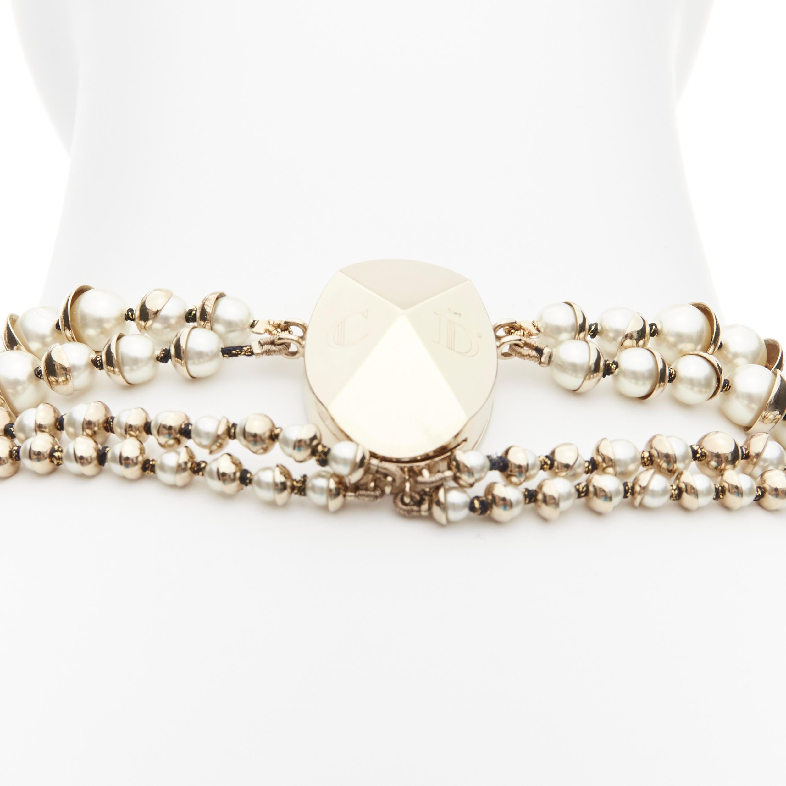CHRISTIAN DIOR Galliano Vintage faux pearl gold tone CD clasp tribal layered necklace
Reference: TGAS/D00243
Brand: Christian Dior
Designer: John Galliano
Material: Faux Pearl, Metal
Color: Pearl, Gold
Pattern: Solid
Closure: Magnet
Extra Details: