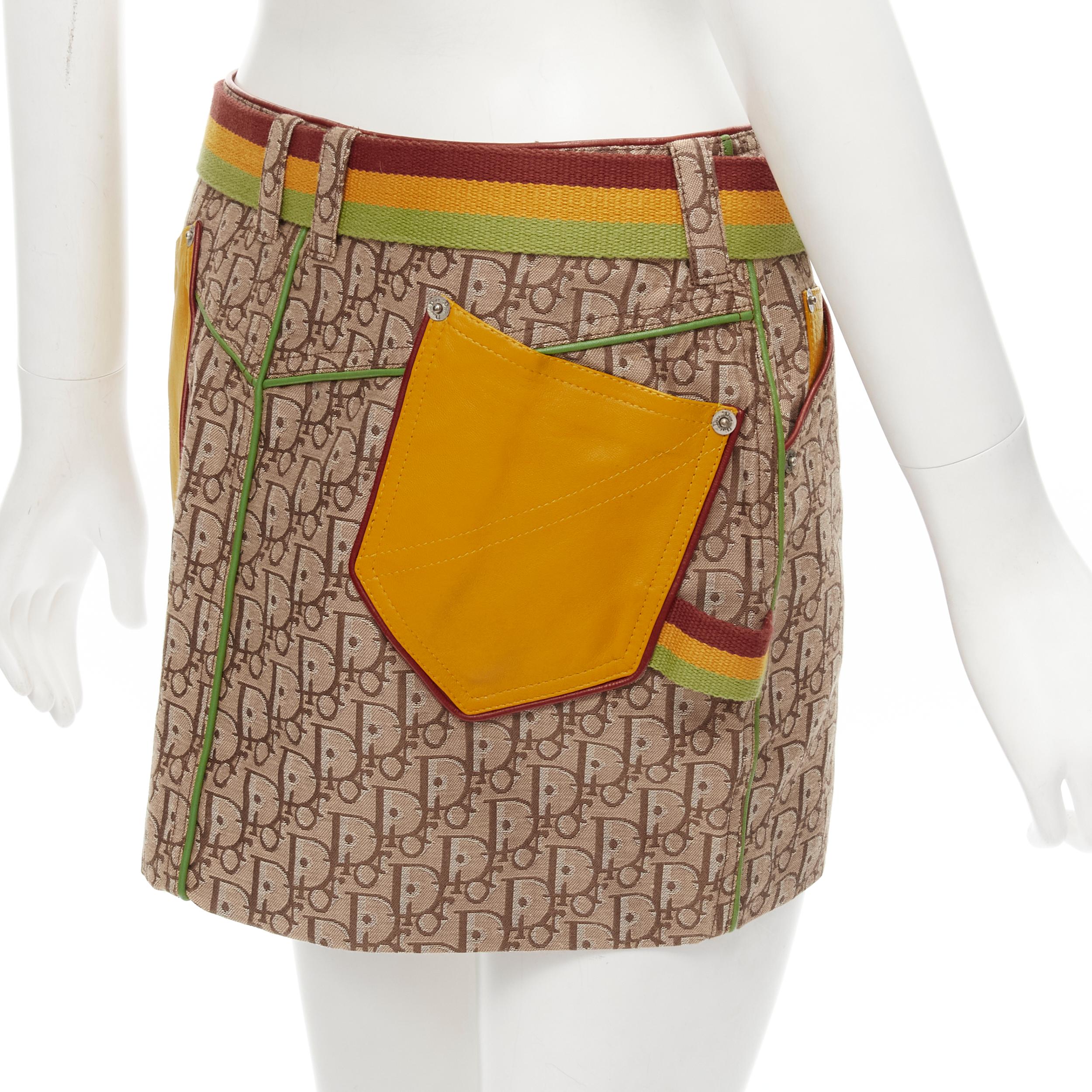 CHRISTIAN DIOR Galliano Y2K Rasta belted leather trim monogram mini skirt XS 
Reference: ANWU/A00529 
Brand: Christian Dior 
Designer: John Galliano 
Collection: Rasta Runway 
Material: Feels like cotton 
Color: Brown 
Pattern: Logo 
Closure: Button