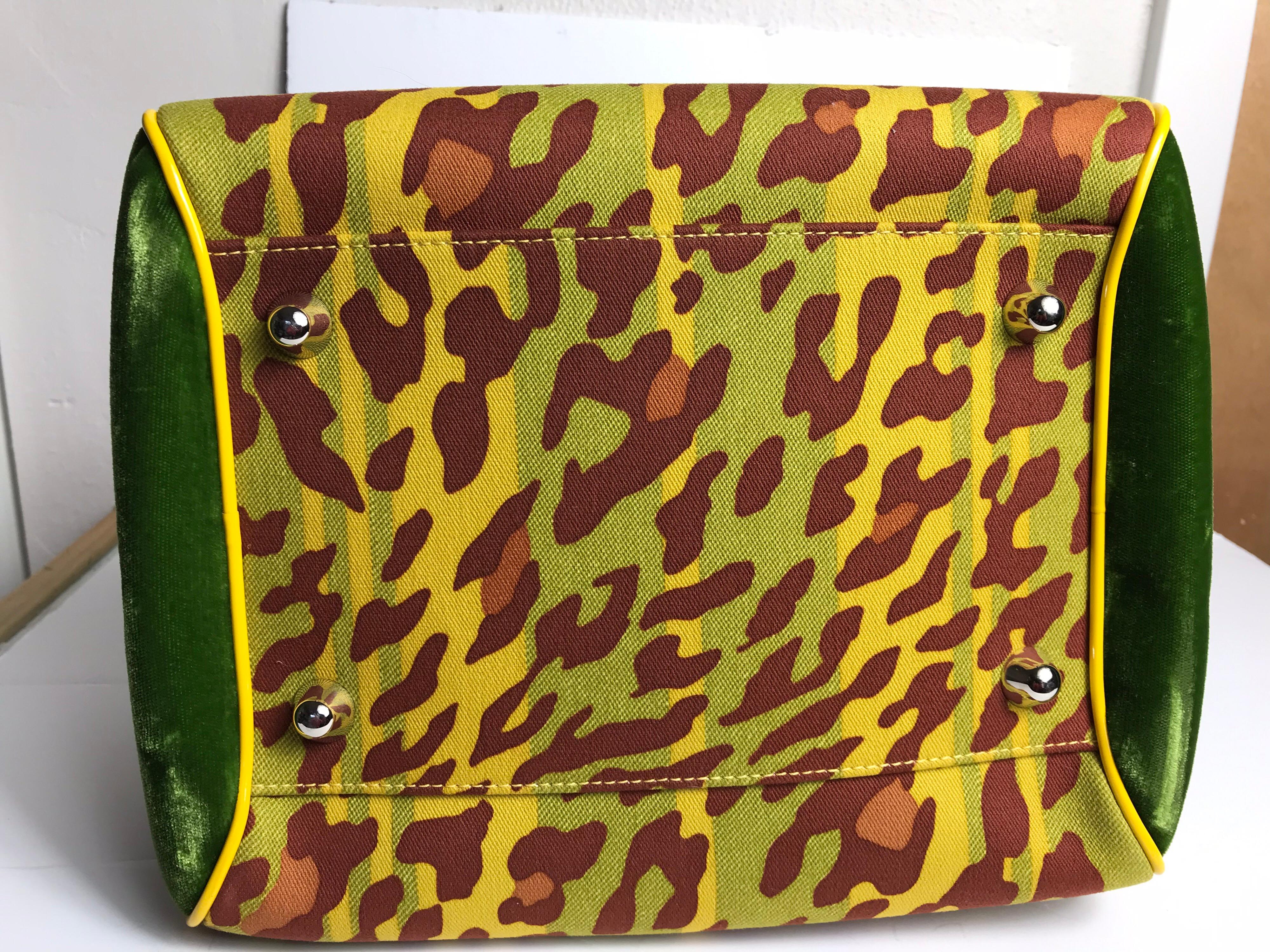 Christian Dior Gambler Dice Bowler Bag. Yellow, green and multicolored printed canvas. With silver tone hardware duel interior pockets. 8” H, 10.5