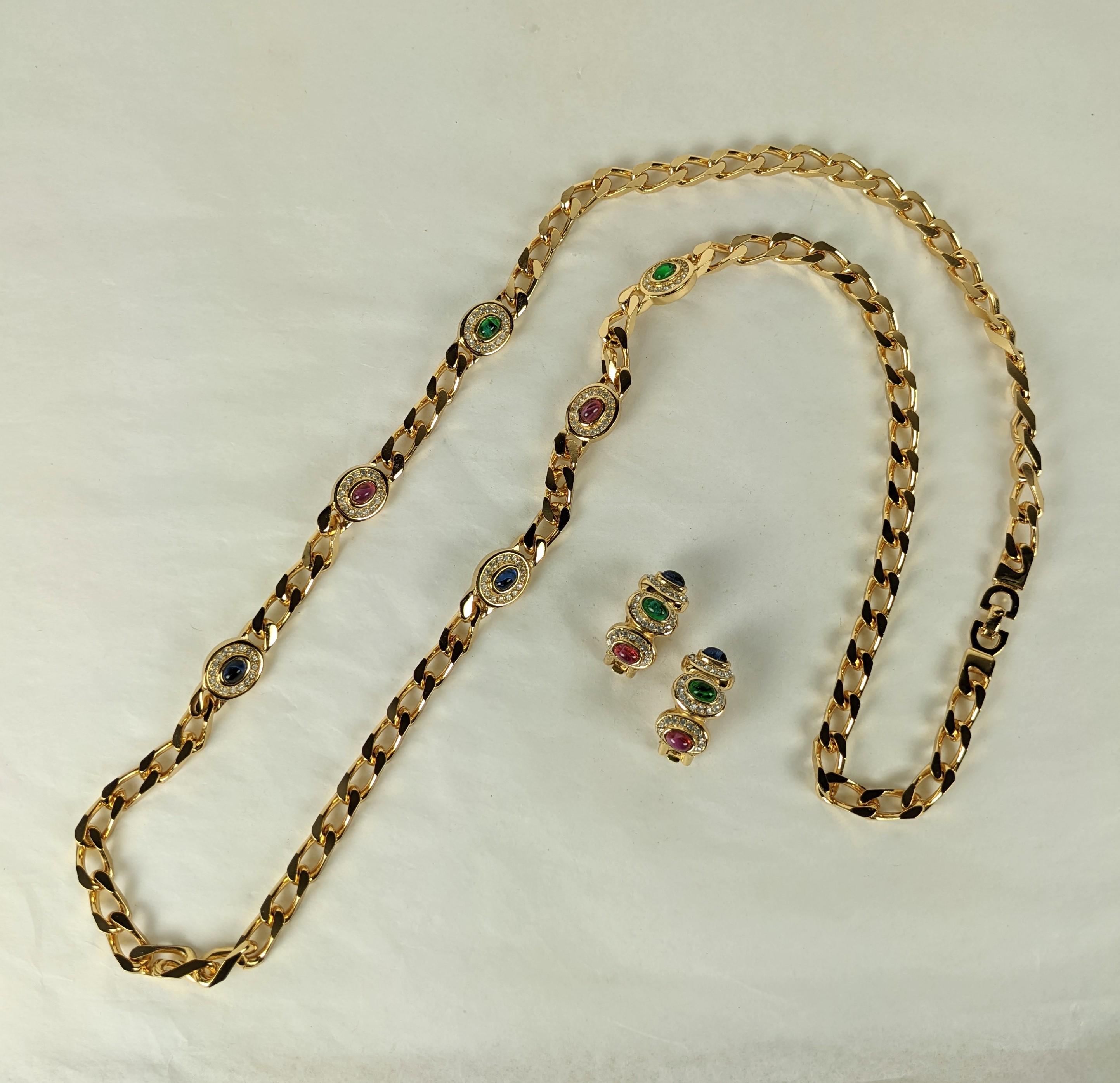 Elegant Christian Dior Gem Station Chain and Ear Clips from the 1980's. Gilt curb chain with pave stations of faux ruby, emerald and sapphire cabs. Stations are reversible on both sides.
Clip earrings with matching cabochons.  1980's Dior, France.