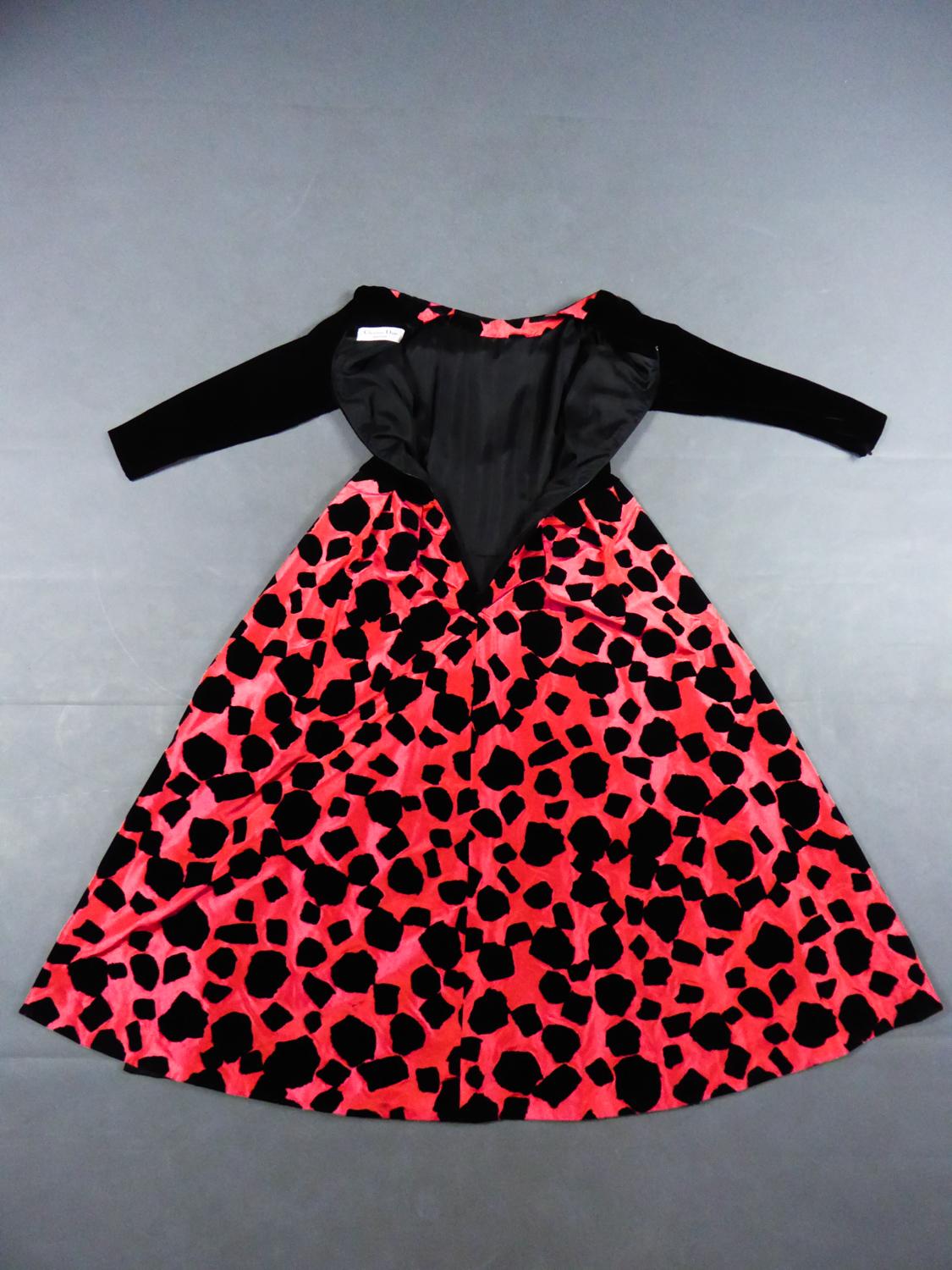 Circa 1990
France

Christian Dior / Gianfranco Ferré long evening dress from the early 1990s. Amazing skirt with large pleated background in fuschia taffeta printed random black velvet stains with spray adhesive . Bustier with long sleeves and back