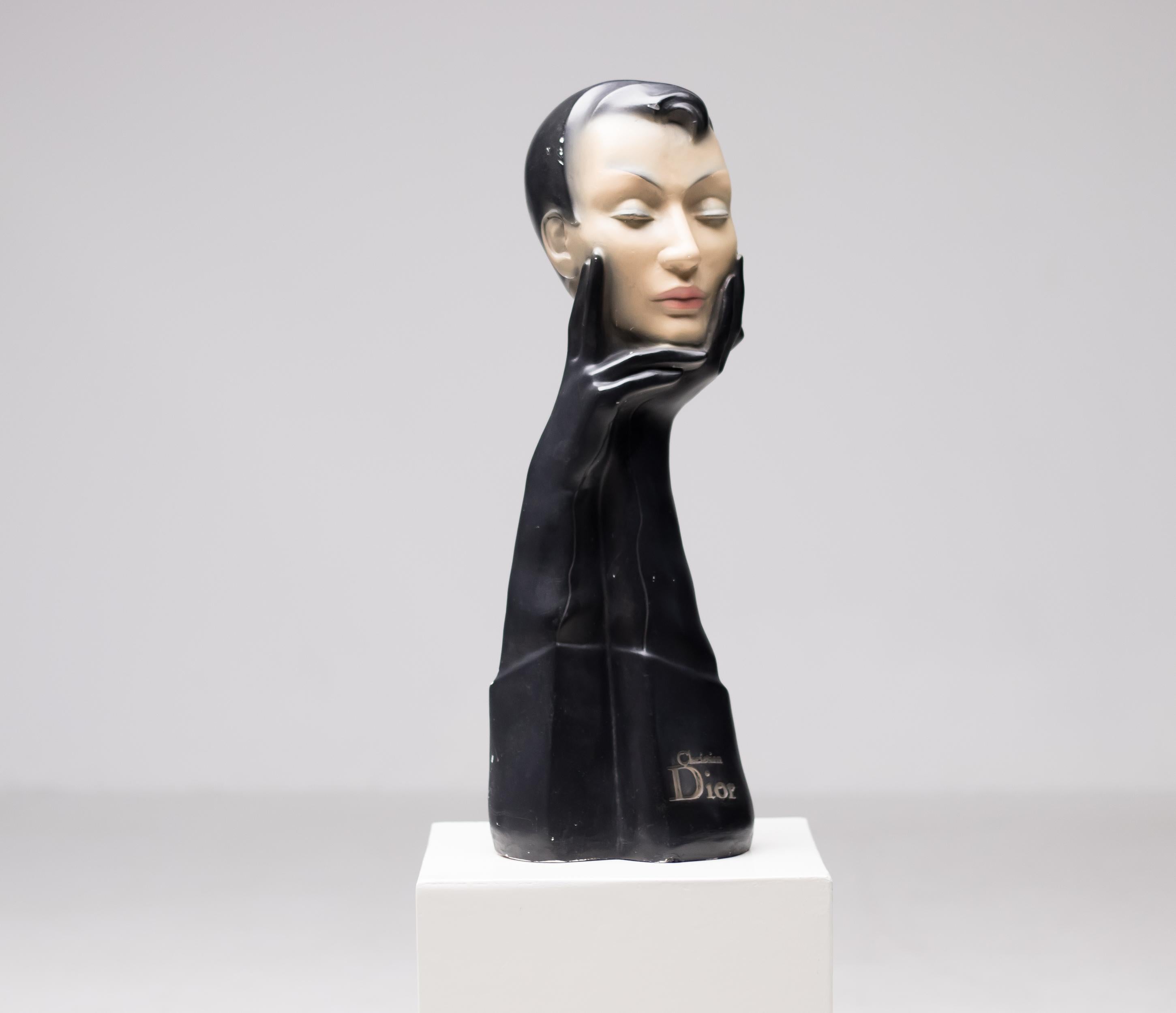 Christian Dior gloved mannequin head. Designed to display glasses, scarves or hats, by Christian Dior in the 1950s. This mannequin was made by the Gemini Company. Signed Christian Dior. A piece of Art Deco chic and elegance, this mannequin is made