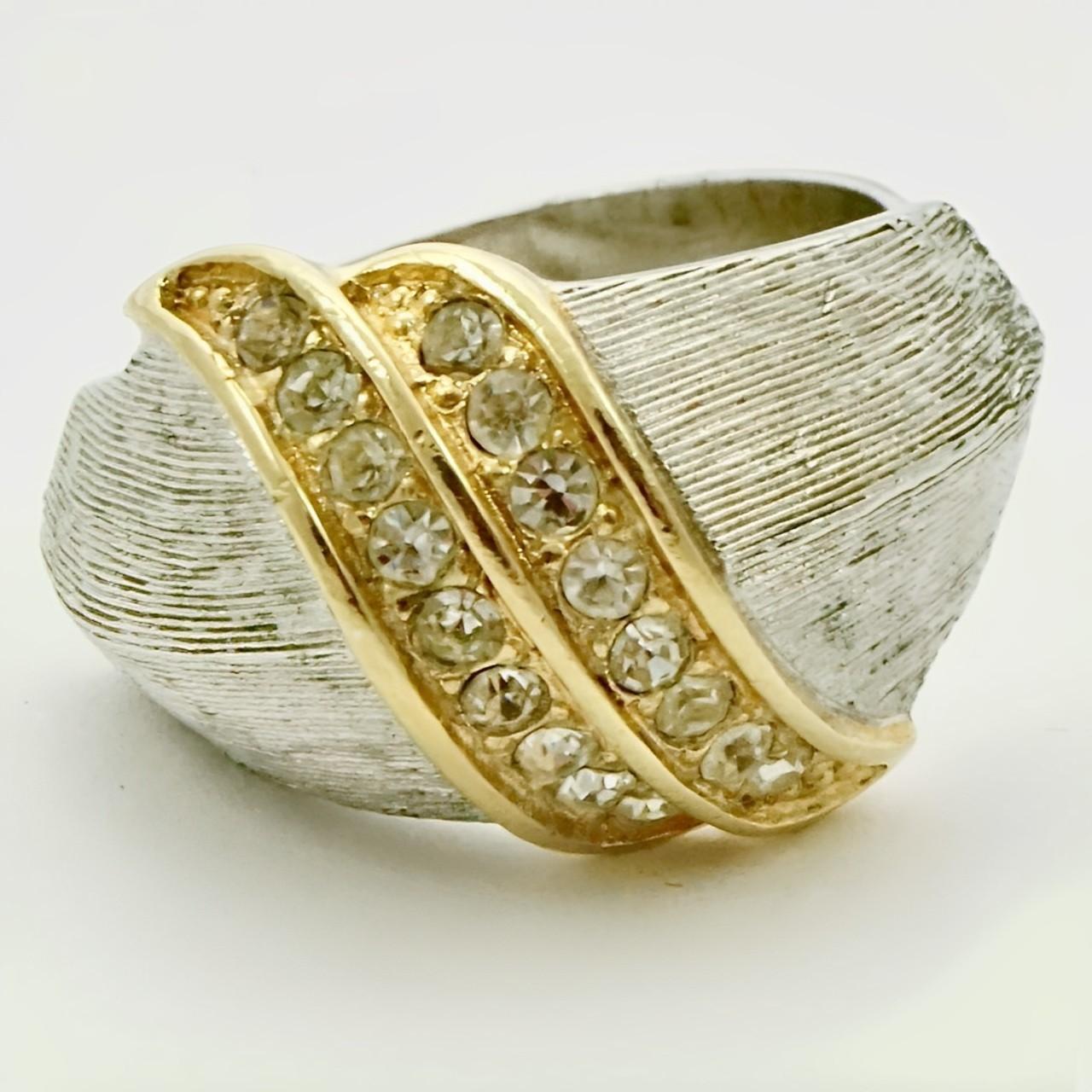 Fabulous Christian Dior gold and silver plated ring featuring a double row of clear rhinestones edged in gold plating. Ring size UK L 1/2, US 5 7/8, but adjustable. The front measures length 1.3cm / 1.18 inch.

This is a beautiful and stylish