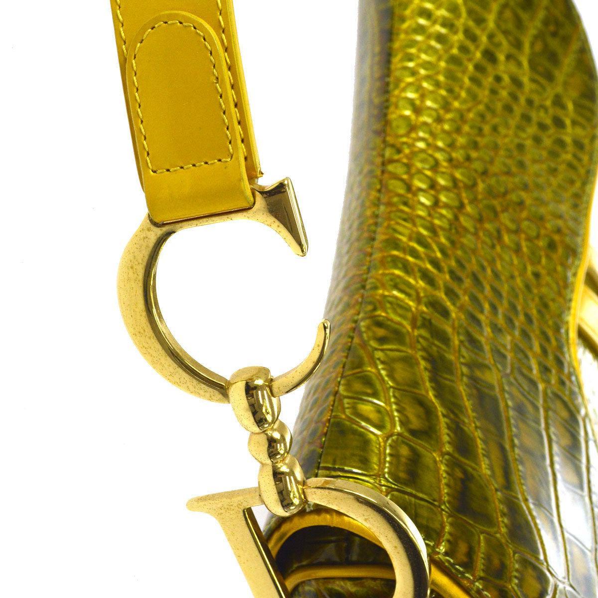 Christian Dior Gold Green Gold Patent Leather Saddle 'CD' Logo Charm Shoulder Bag 

Patent leather
Leather trim
Gold tone hardware
Velcro closure
Woven lining
Made in Italy
Shoulder strap drop 7