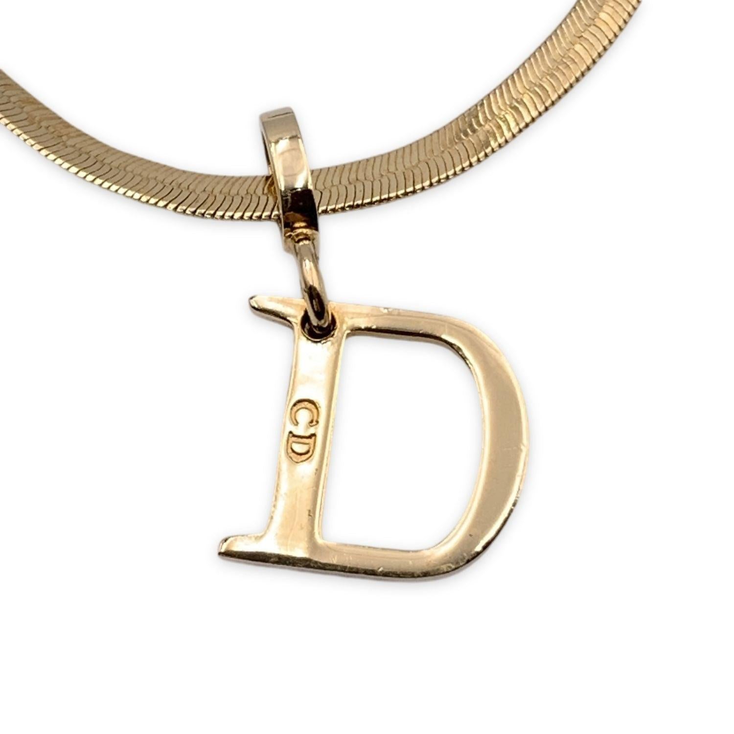Vintage Christian Dior snake gold metal bracelet with D letter pendant charm. Lobster closure. Small CD - Dior charm at the end of the bracelet. Max chain length: about 7 inches - 17.7 cm Condition A - EXCELLENT Gently used. Please, look carefully