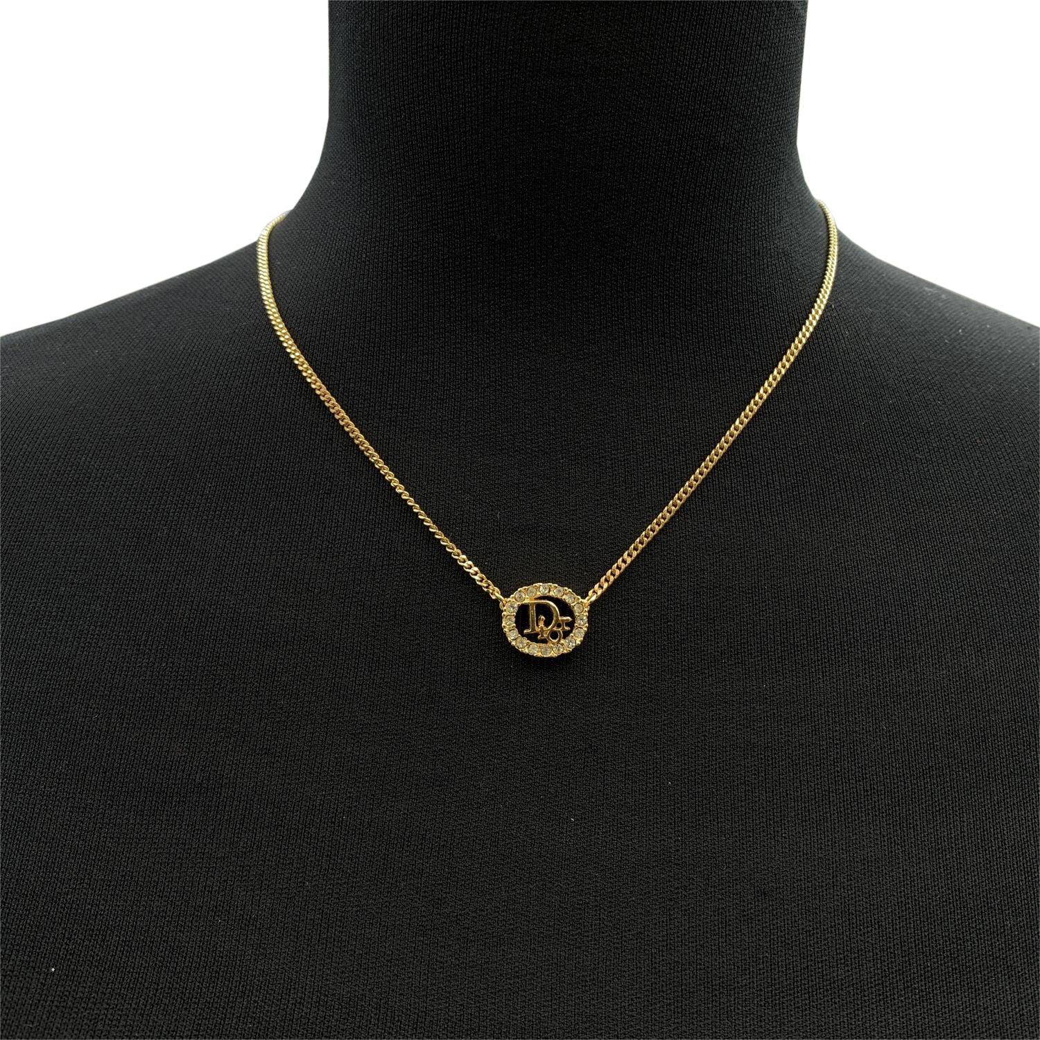 Vintage Christian Dior gold metal chain necklace. Oval Dior logo pendant with crystal accents. Lobster closure. CD small charm at the end of the chain (marked Chr.Dior Chain length: about 16 inches - 40.5 cm. Made in Germany. Condition A - EXCELLENT