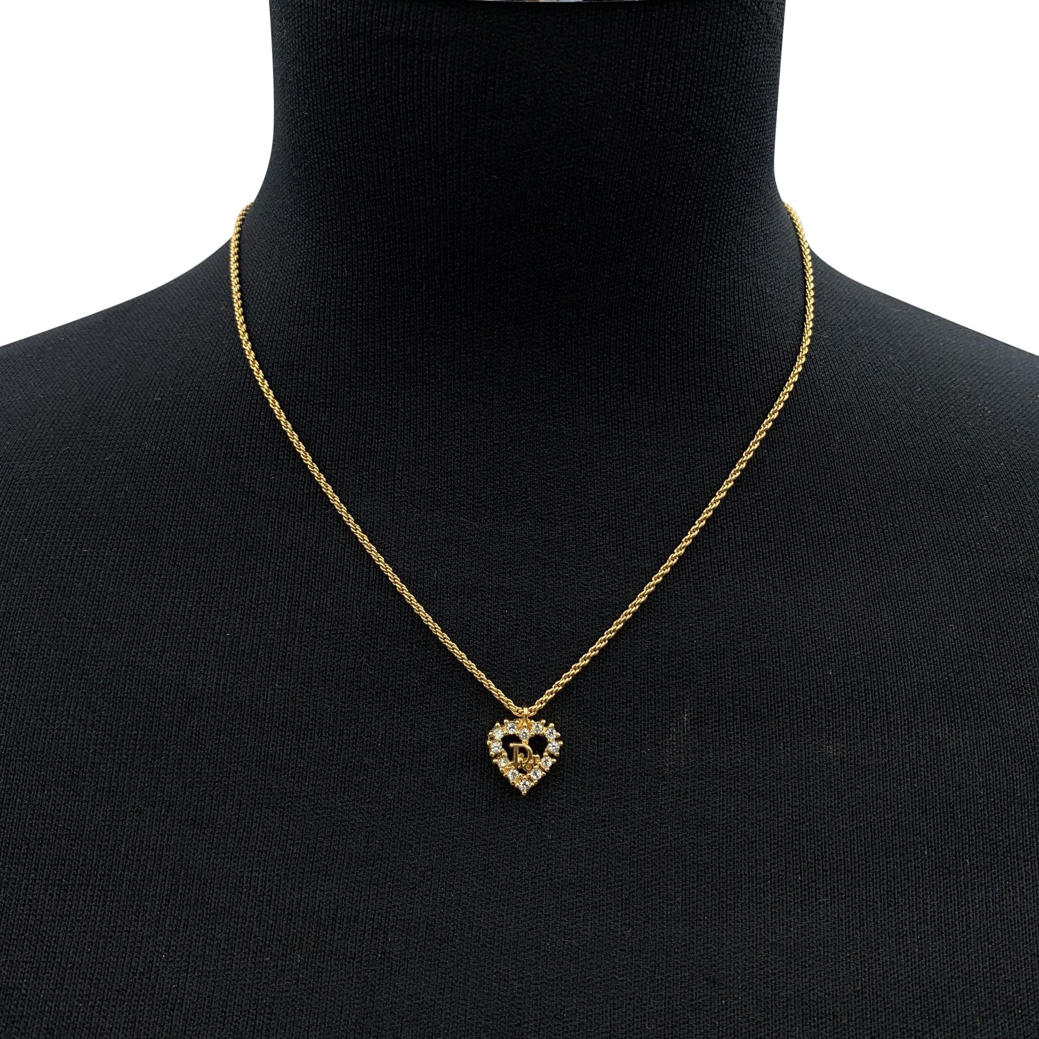 Vintage Christian Dior gold metal chain necklace. Heart -shaped Dior logo pendant with crystal accents. Spring ring closure. CD small charm at the end of the chain (marked Chr.Dior). Chain length: about 17 inches - 43.2 cm Condition A - EXCELLENT