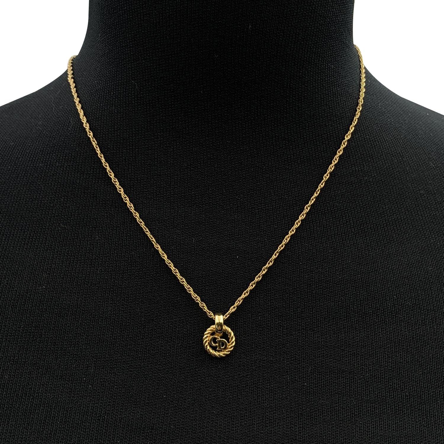 Vintage Christian Dior gold metal chain necklace with small round CD logo pendant. Lobster closure. Small CD charm at the end of the necklace. Chain length: about 16 inches - 40.6 cm Condition A - EXCELLENT Gently used. Please, look carefully at the