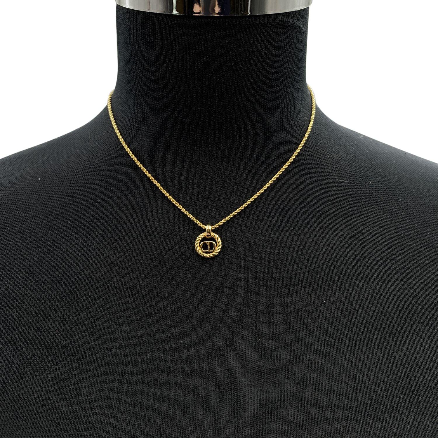 Vintage Christian Dior gold metal chain necklace with small round CD logo pendant. Lobster closure. Small CD charm at the end of the necklace. Chain length: about 16.5 inches - 41.8 cm Condition A - EXCELLENT Gently used. Please, look carefully at