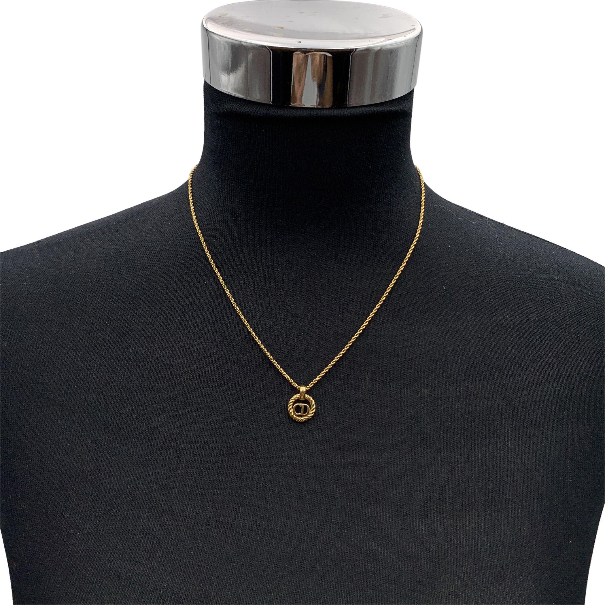 Vintage Christian Dior gold metal chain necklace with small round CD logo pendant. Lobster closure. Small CD charm at the end of the necklace. Chain length: about 17 inches - 43.2 cm Condition A - EXCELLENT Gently used. Please, look carefully at the