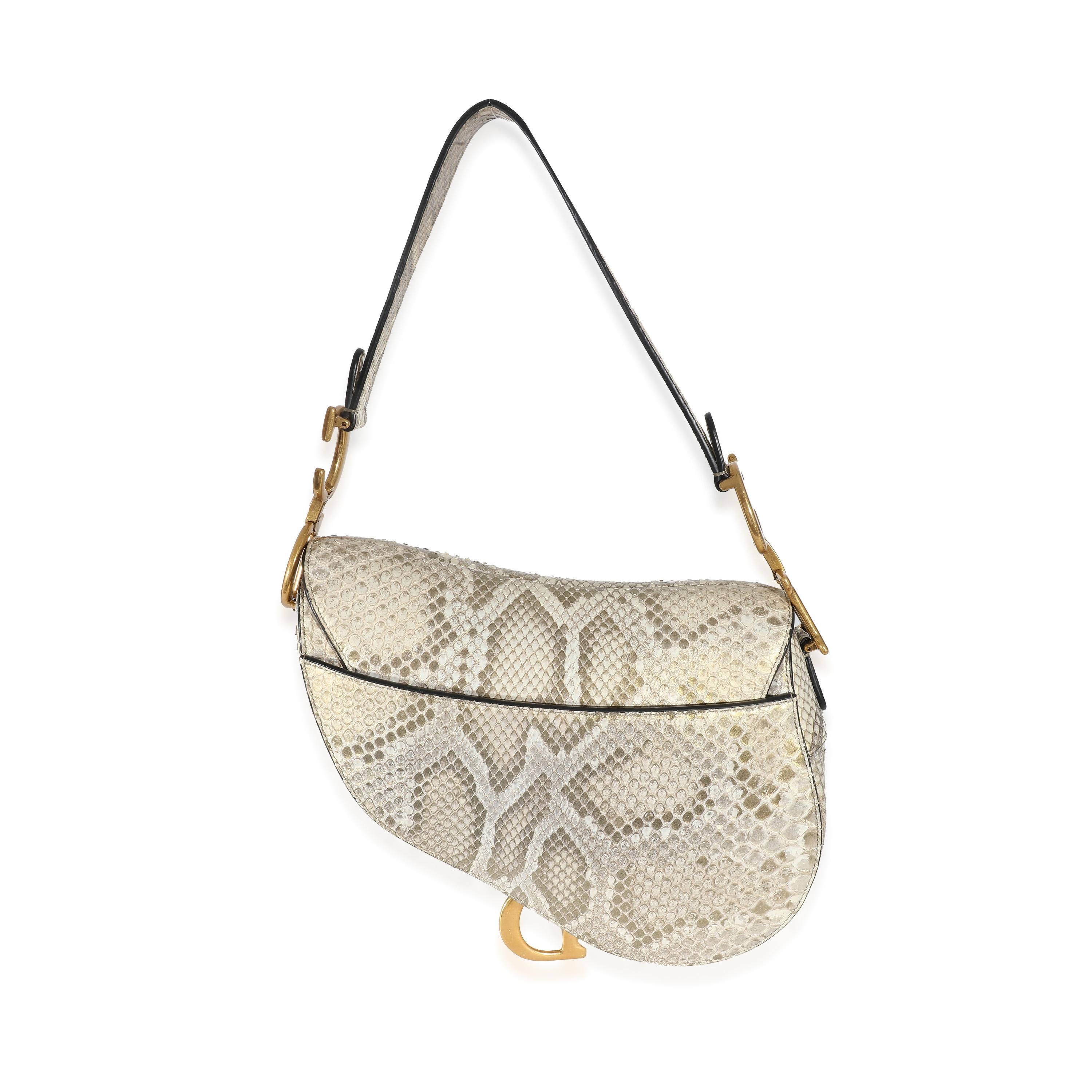 Listing Title: Christian Dior Gold Metallic Python Saddle Bag
SKU: 134013
Condition: Pre-owned 
Handbag Condition: Very Good
Condition Comments: Item is in very good condition with minor signs of wear. Exterior scuffing throughout lining. Scratching