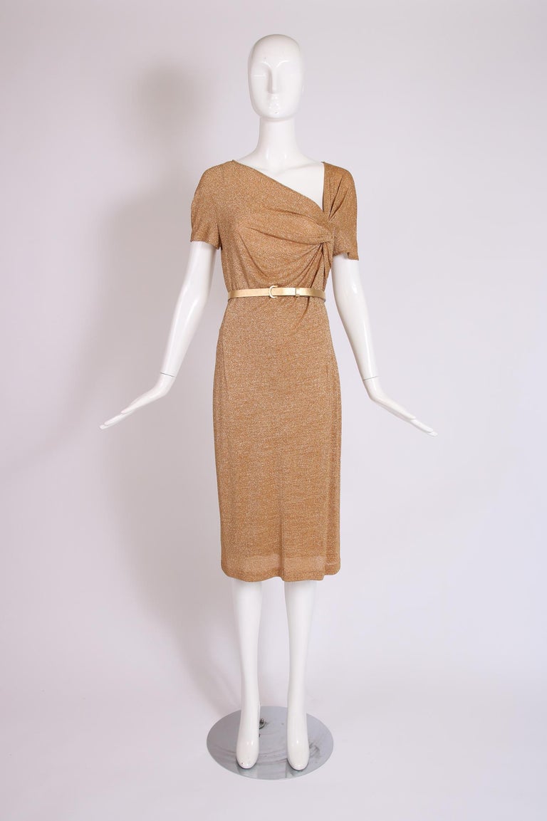 Christian Dior gold metallic stretchy dress with gold leather belt. Fabric is viscose and modal. Size tag 44 but this isn't accurate - should fit a size 8. In excellent condition. 

Bust: 36