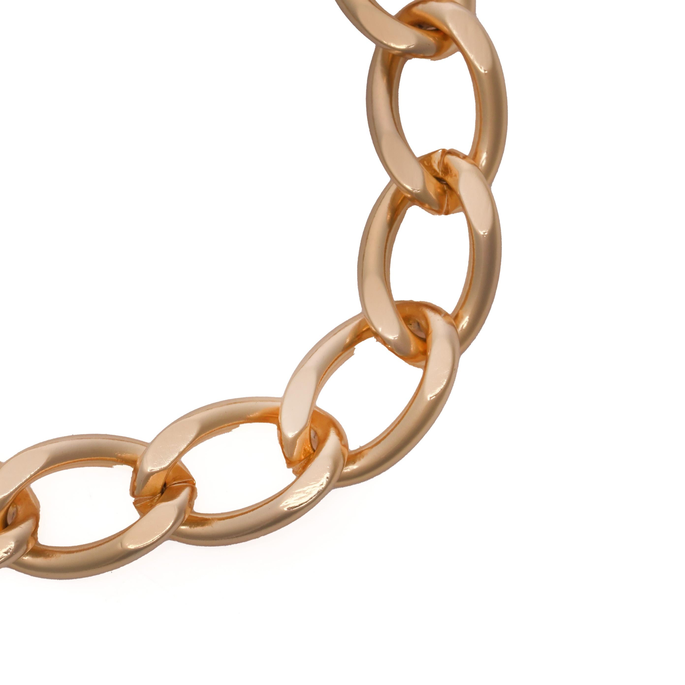 A vintage Christian Dior bracelet from the 1980s, crafted in polished gold-plated metal and designed with classic interlocking links. The bracelet fastens with Dior’s iconic CD logo foldover clasp, marked Chr. Dior, Germany, confirming authenticity.