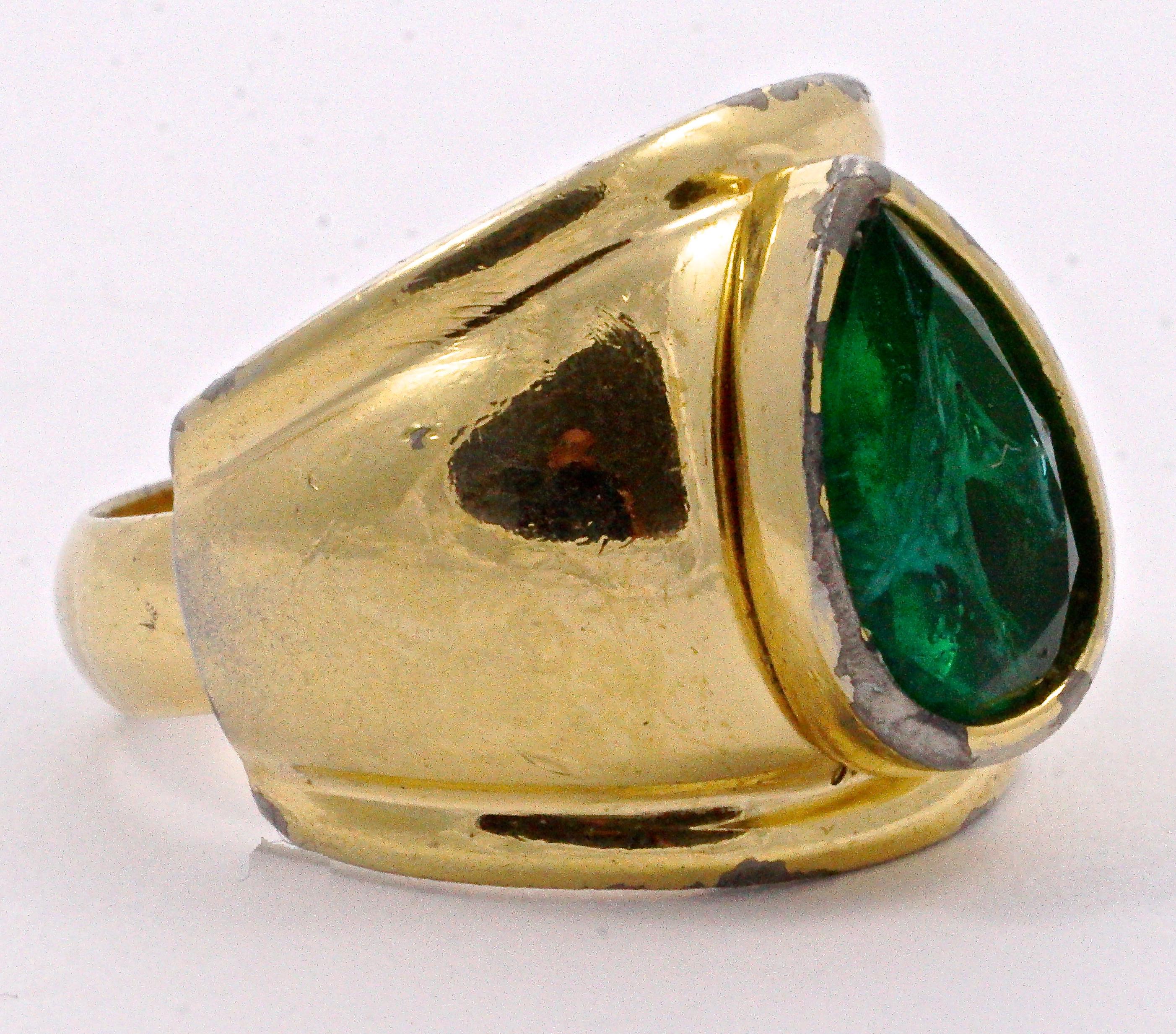 Christian Dior gold plated ring featuring a lovely pear shaped faux emerald. Ring size UK Q, US 8 (inside diameter 1.7cm / .67 inch). The 'emerald' is 1.3cm / 1.18 inch by maximum 8mm / .31 inch, and features milky swirls, which imitates real flawed