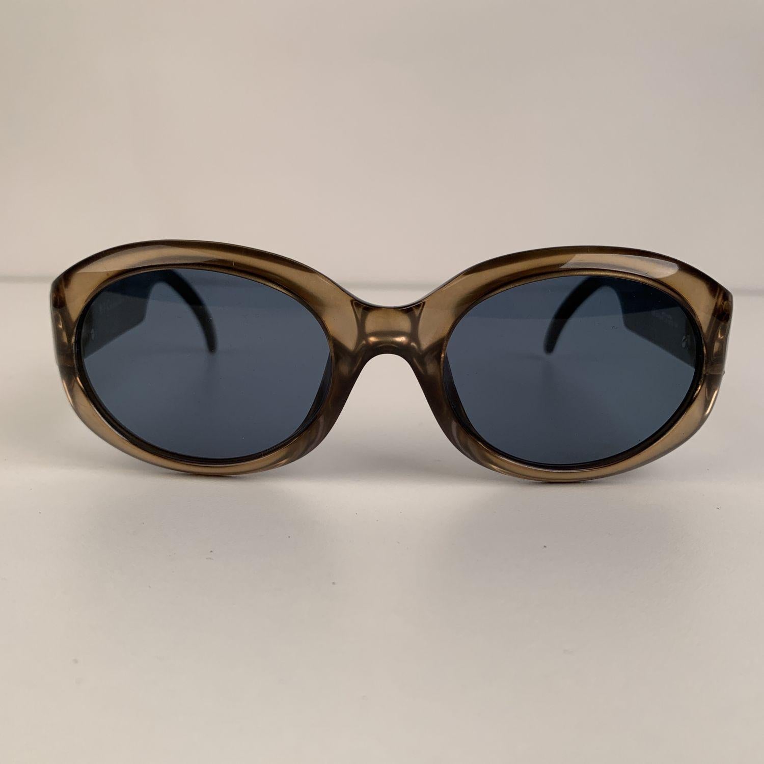 Beautiful Sunglasses designed by Christian Dior in gold tone color. Acetate oval OPTYL frame with cannage pattern on the ear stems and silver metal CD logo on temple. High quality original lenses, 100% UV 3 protection. Mod. and Refs: DIORAMA - 22 H