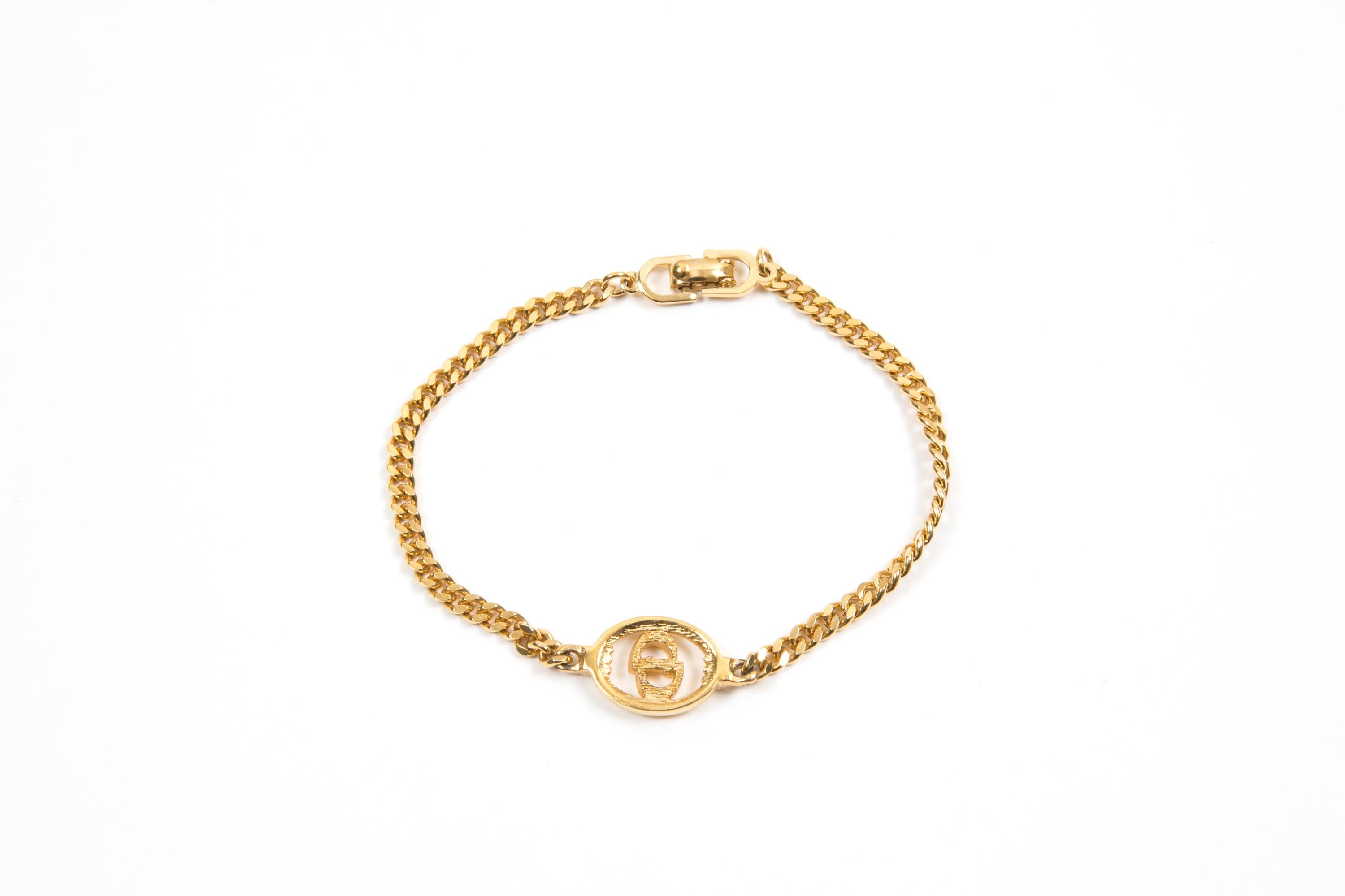 Christian Dior Gold-tone “CD” bracelet featuring a thin chain, a center “Dior” in an oval outline, a claps fastening. 
Length: 7in. (18cm)
Circa: 1990s
In good vintage condition. Made in France.
We guarantee you will receive this  iconic item as