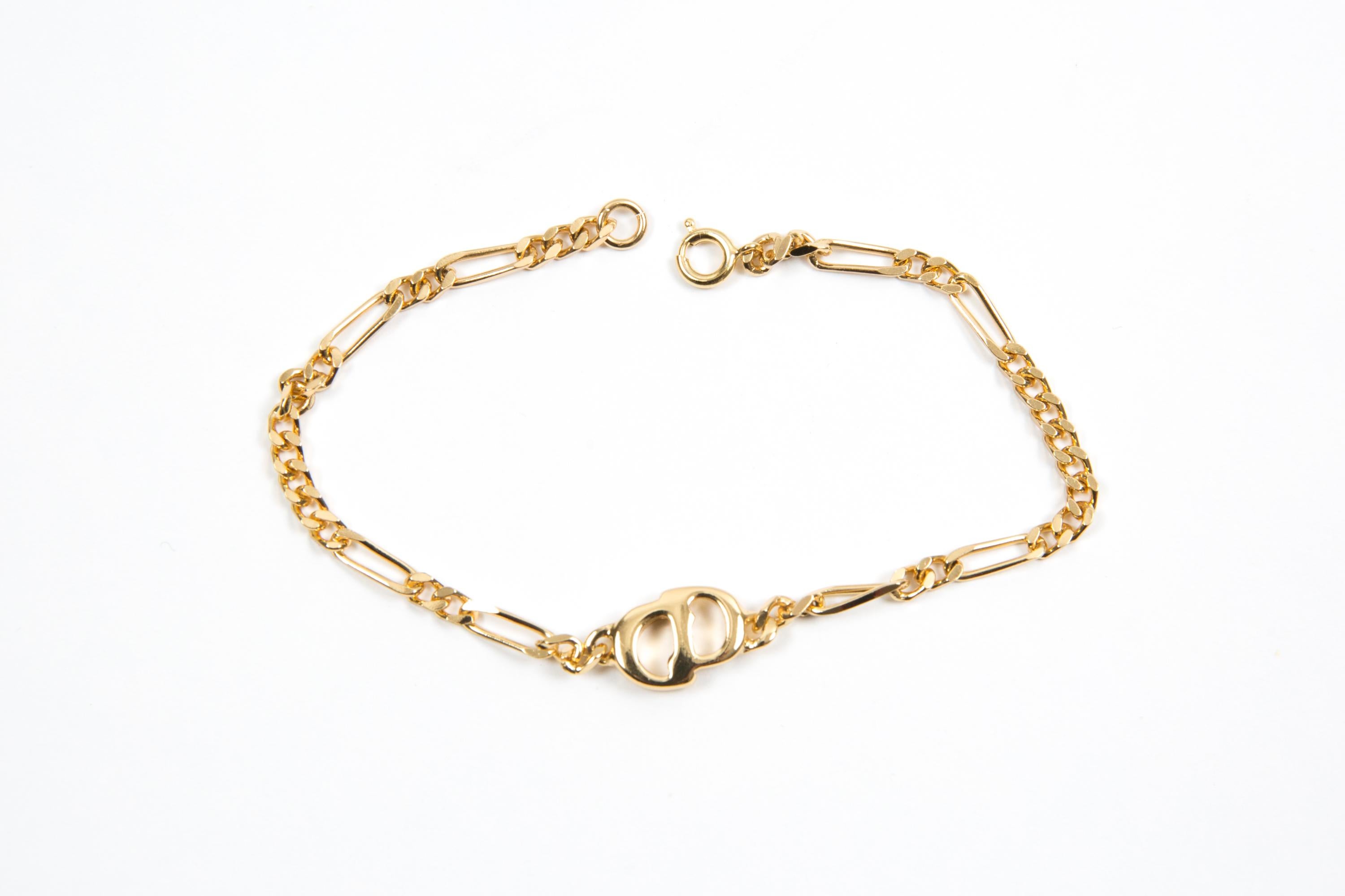Christian Dior Gold-tone “CD” bracelet featuring  a fancy chain, a center “CD”, a lobster claw fastening. 
Length: 7.4in. (19cm)
Circa: 1990s
In good vintage condition. Made in France.
We guarantee you will receive this  iconic item as described and