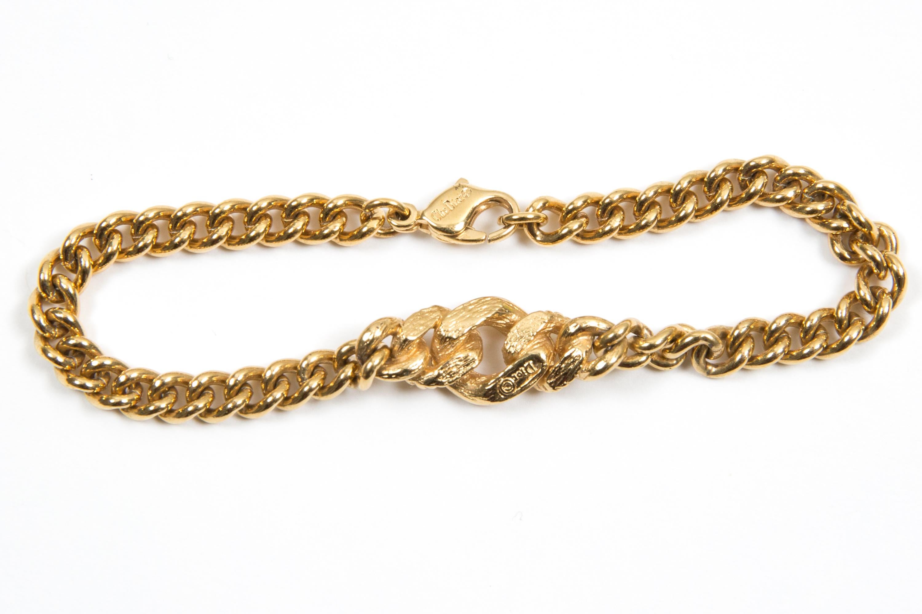Christian Dior gold-tone chain bracelet featuring a center large cable part, a logo CD fastening. 
Length: 7.4in. (19cm)
Circa: 1990s
In good vintage condition. Made in France.
We guarantee you will receive this  iconic item as described and showed