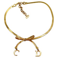 CHRISTIAN DIOR Gold Tone Flat Herringbone Bow CD Logo Necklace