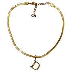 CHRISTIAN DIOR Gold Tone Flat Herringbone D Pendant Necklace