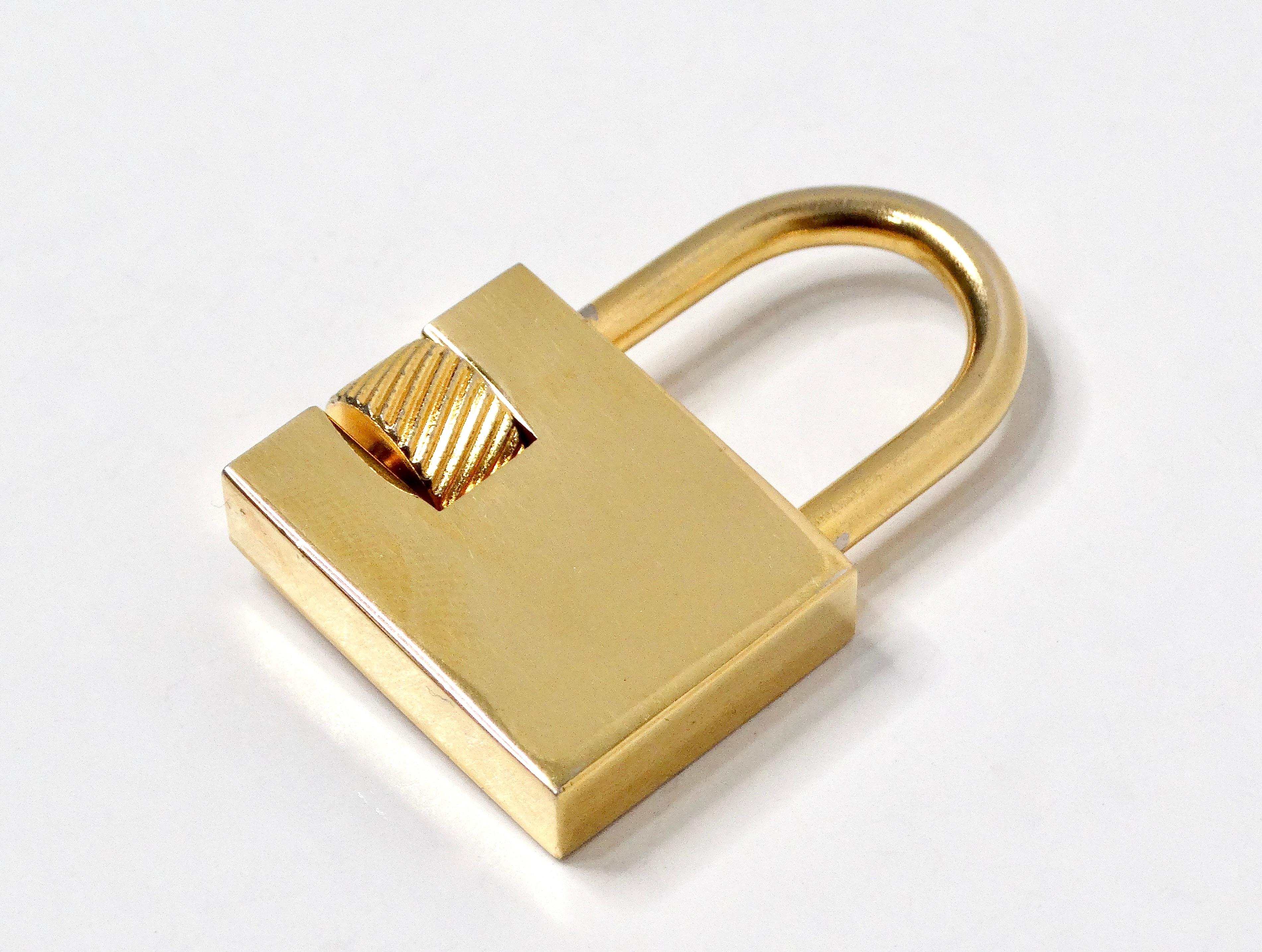 Orange Christian Dior Gold-Tone Logo Engraved Padlock Charm Pendant For Sale