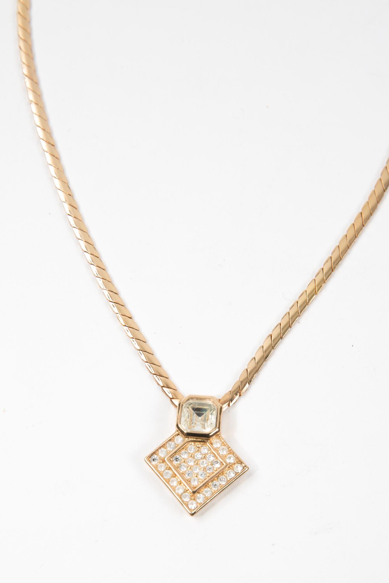 Christian Dior Gold-tone medal necklace featuring a large center strass medal, a logo fastening, an adjustable fit, spring-ring fastening.
Length: 16.54in. (42cm)
Circa: 1980s
In good vintage condition. Made in France.
We guarantee you will receive