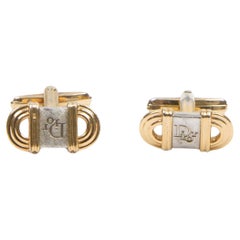 Gemelos con logotipo ovalado en tono dorado de Christian Dior