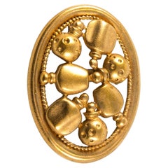 Spilla con flaconi di profumo in oro di Christian Dior