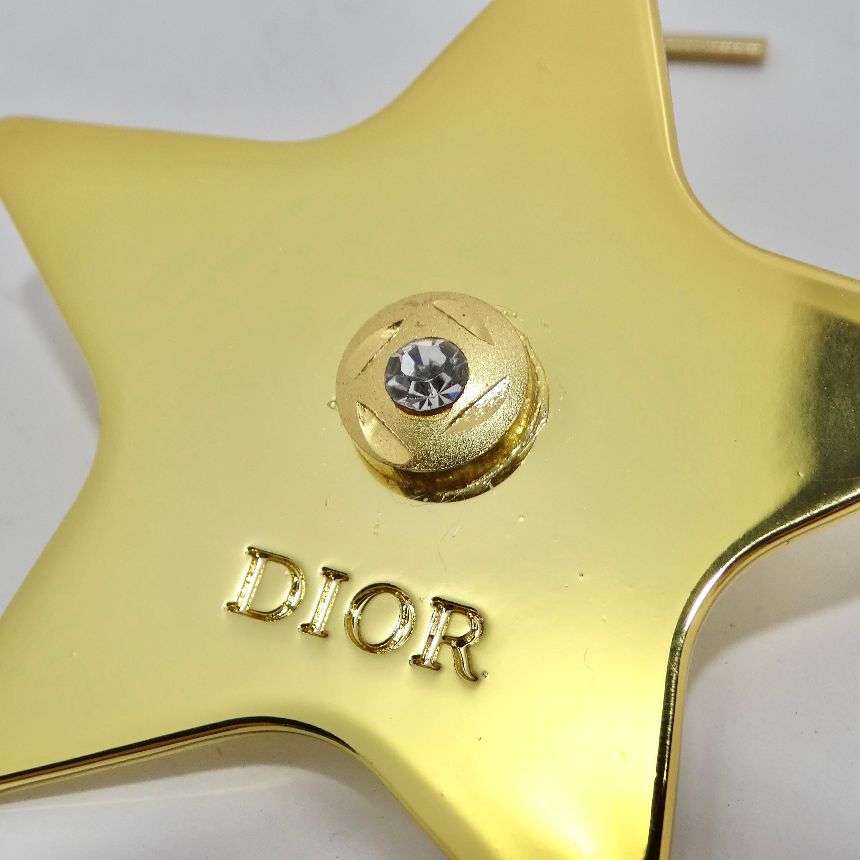 Introducing the Christian Dior Gold Tone Star Pin – a dazzling accessory that will elevate your style to celestial heights. Crafted with precision and plated in luxurious yellow gold, this star-shaped pin is a symbol of elegance and sophistication.