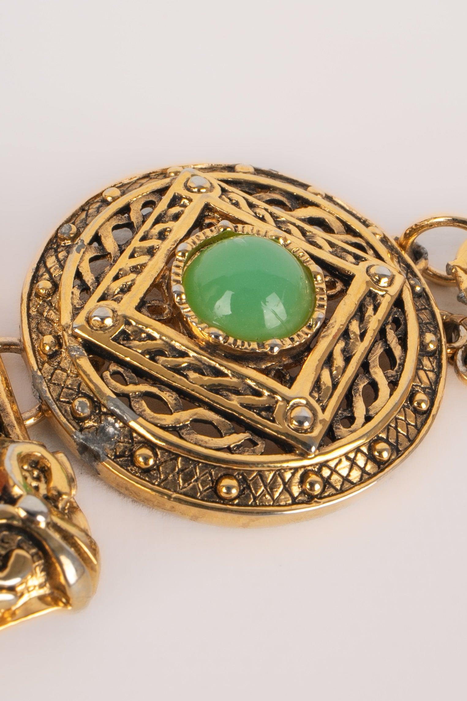 DIOR - Golden metal belt with glass cabochons. A 1990 circa Collection.

Additional information:
Condition: Good condition
Dimensions: Length: 86 cm

Seller Reference: BC60
