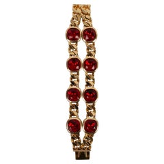 Christian Dior Goldenes Metallarmband mit roten Strasssteinen