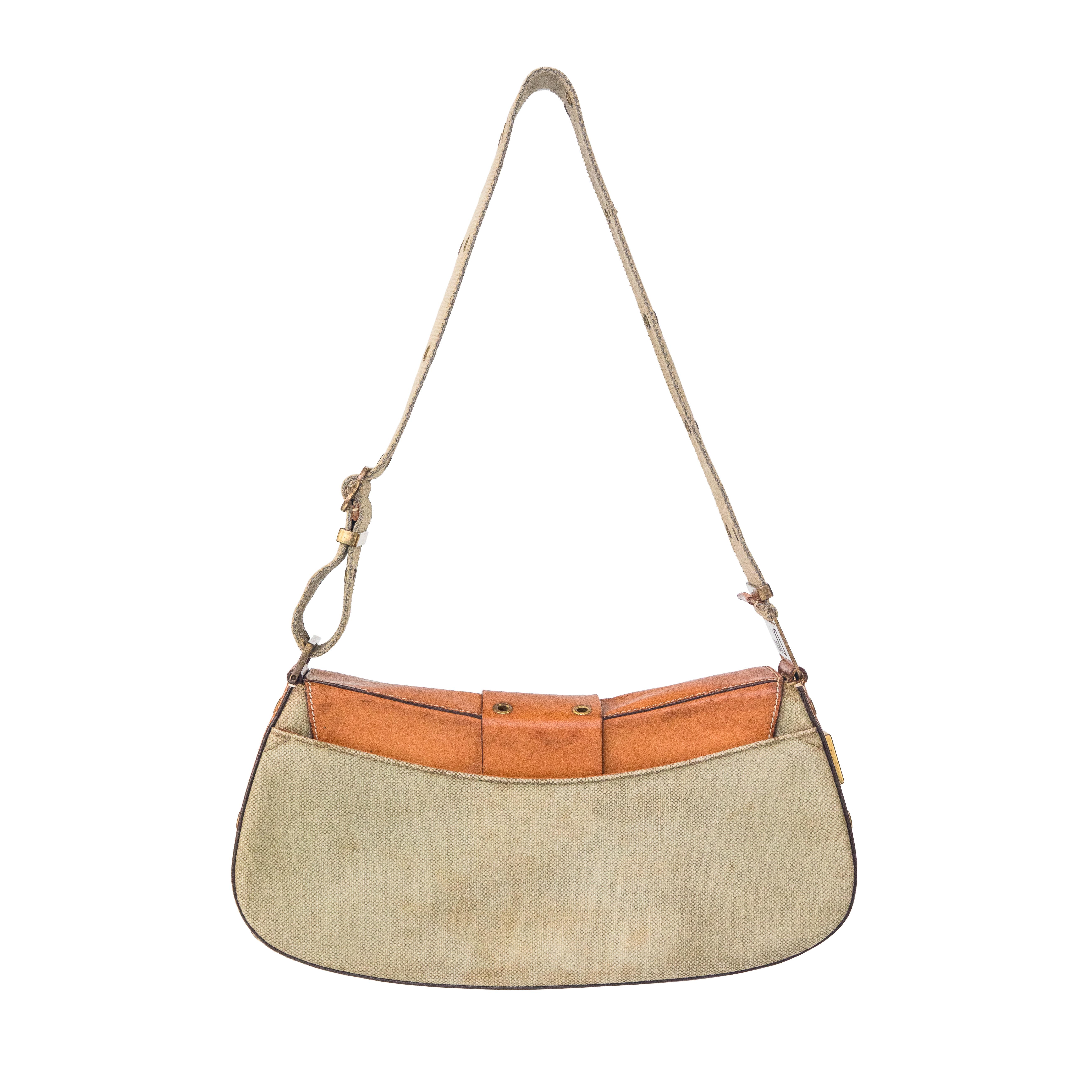 Ruder Than The Rest presents a 2002 Christian Dior canvas and leather Columbus bag from the 'Street Chic' collection.

Heavy green canvas fabric with tan leather.

Brass plated hardware.

Main compartment and one zipped pocket inside.

Inside lining