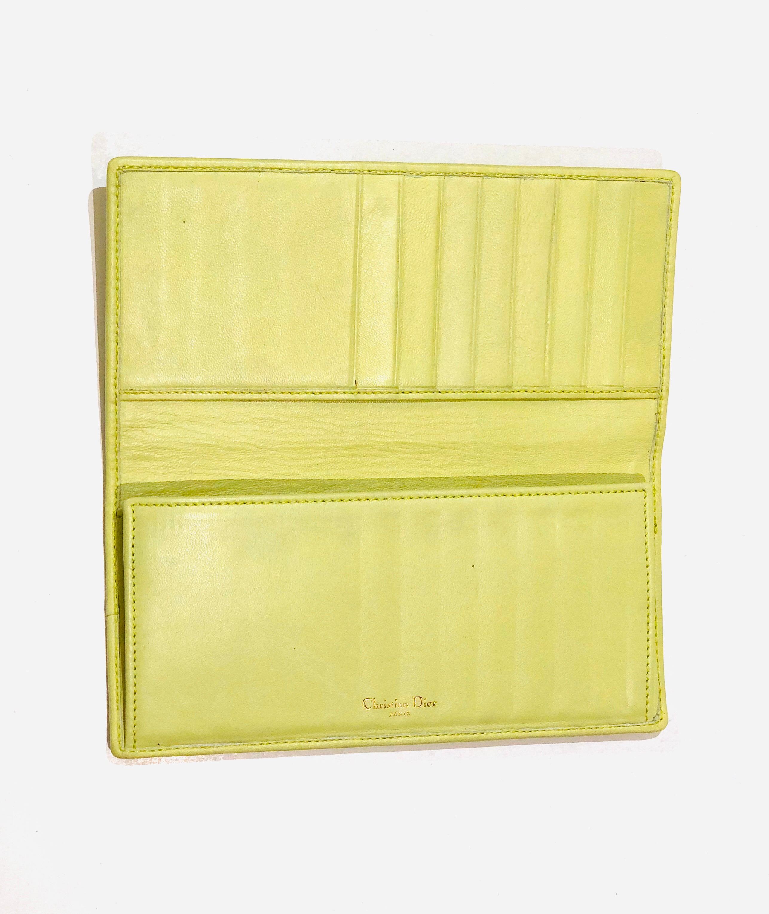 - Christian Dior by John Galliano green lambskin leather long wallet. 

- Eight cards compartments. 

- Zipped compartment. 

- Two 