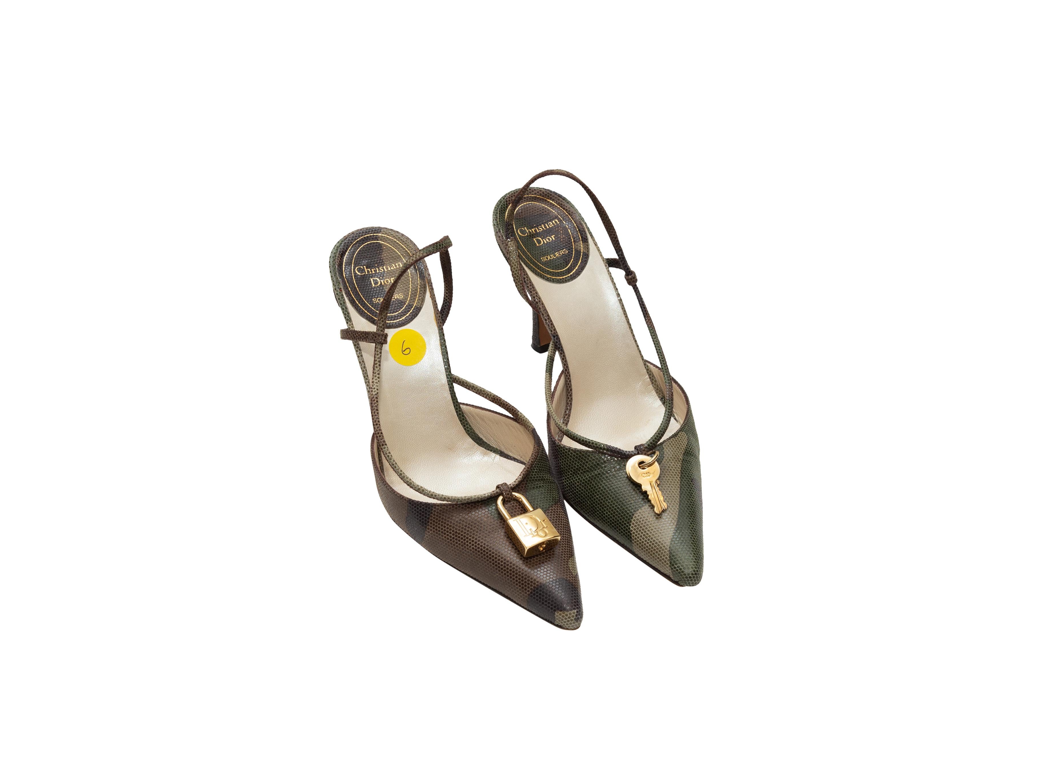 Product details: Green and multicolor pointed-toe slingback pumps by Christian Dior. Camo print throughout. Gold-tone lock and key accents at toe tops. Designer size 36. 3.5