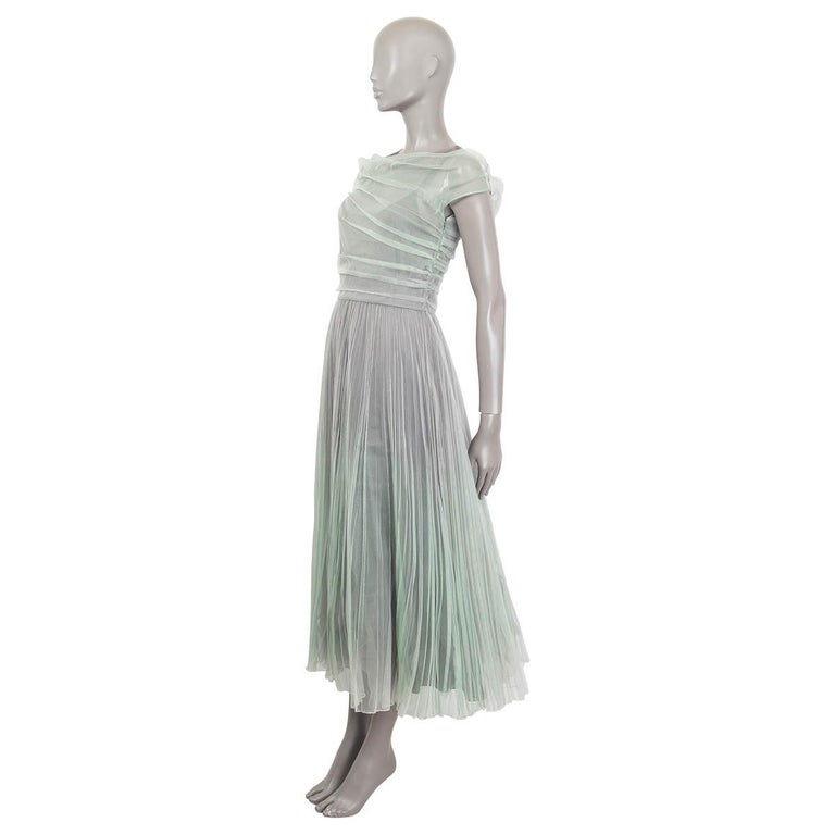 100% authentic Christian Dior Spring/Summer 2019 pleated midi dress in mint and gray silk (100%). Comes with a slip dress (please note that measurements are taken from the slip dress). Slip dress and overdress both open with a zipper and a hook at