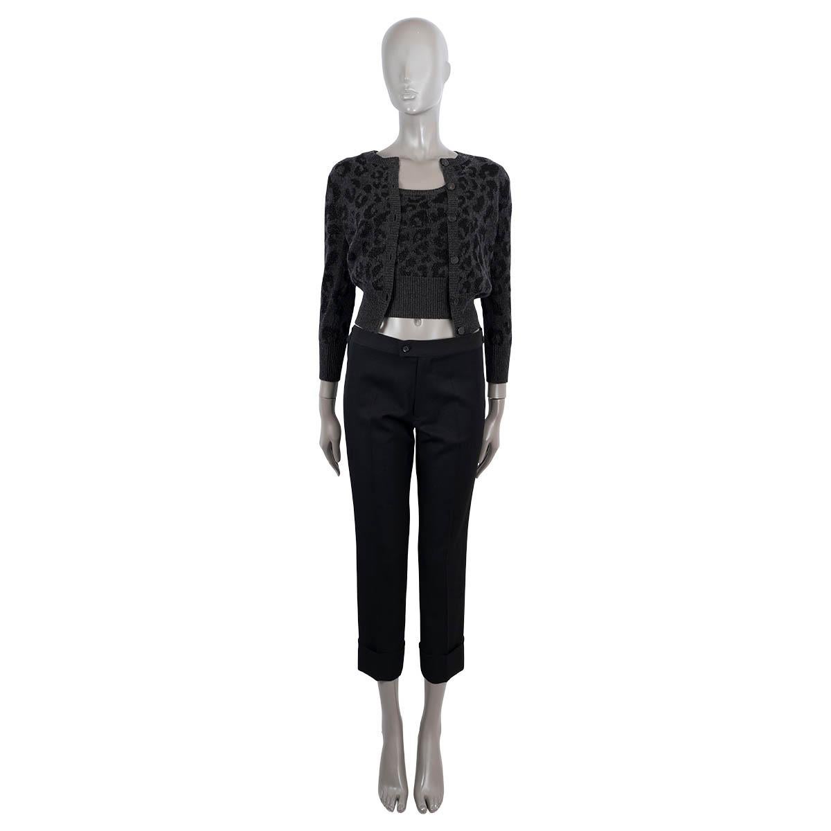 100% authentic Christian Dior Mizza lurex twin-set with a tank-top and a long sleeve buttoned cardigan in grey and black cashmere (85%), cupro (10%) and polyester fibre (5%). Features a ribbed cuffs and hem. Has been worn and is in excellent