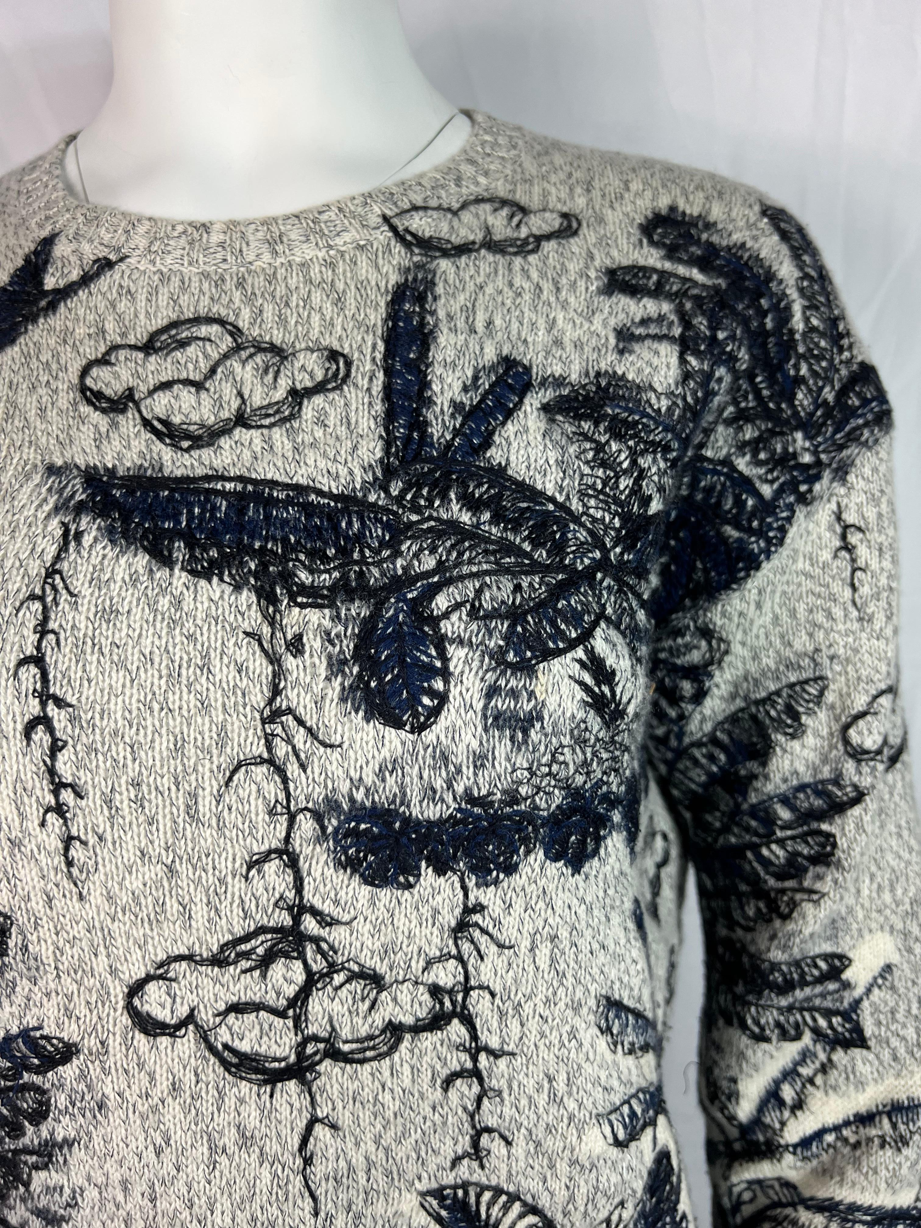 A Christian Dior cashmere sweater, with embroidered design.
​It’s a cozy yet stylish piece with a distinct character and recognizable Dior’s feminine charm.
​Features an amazingly detailed embroidered pattern portraying various flora and fauna