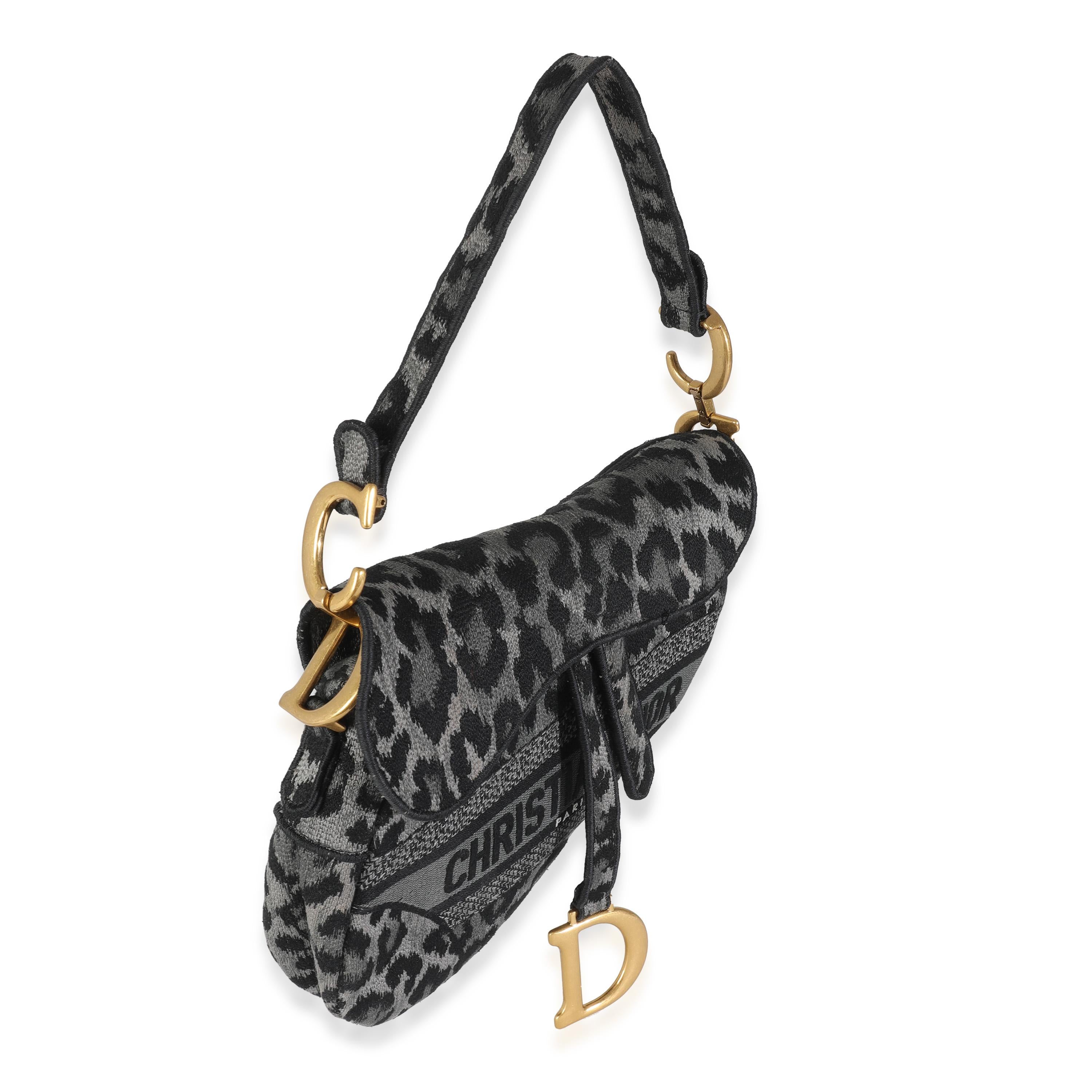 Listing Title: Christian Dior Grey Cheetah Mizza Embroidered Canvas Saddle
SKU: 144544
Condition: Pre-owned 
Condition Description: Designed by John Galliano in 1999, Dior's saddle bag made its debut on the SS00 runway. The cowboy-inspired accessory