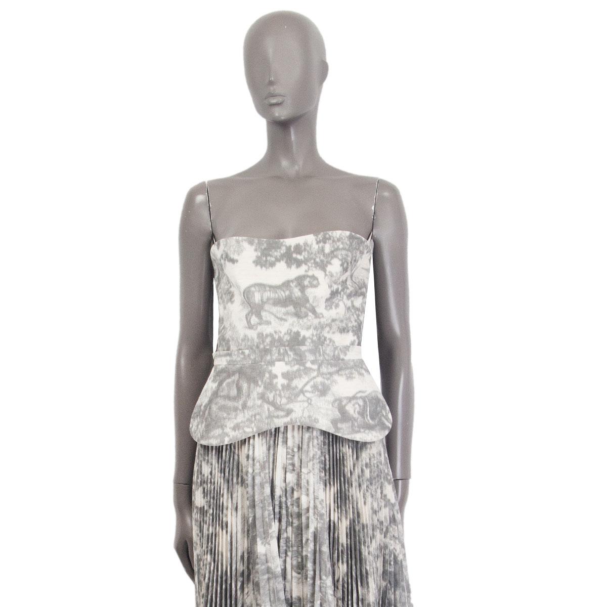 100% authentic Christian Dior Cruise 2019 Toile de Jouy backless dress in light grey and off-white cotton (missing tag). Pleated midi skirt part. Closes with a zipper and two buckles on the back. Has been worn and is in excellent condition. 

Tag