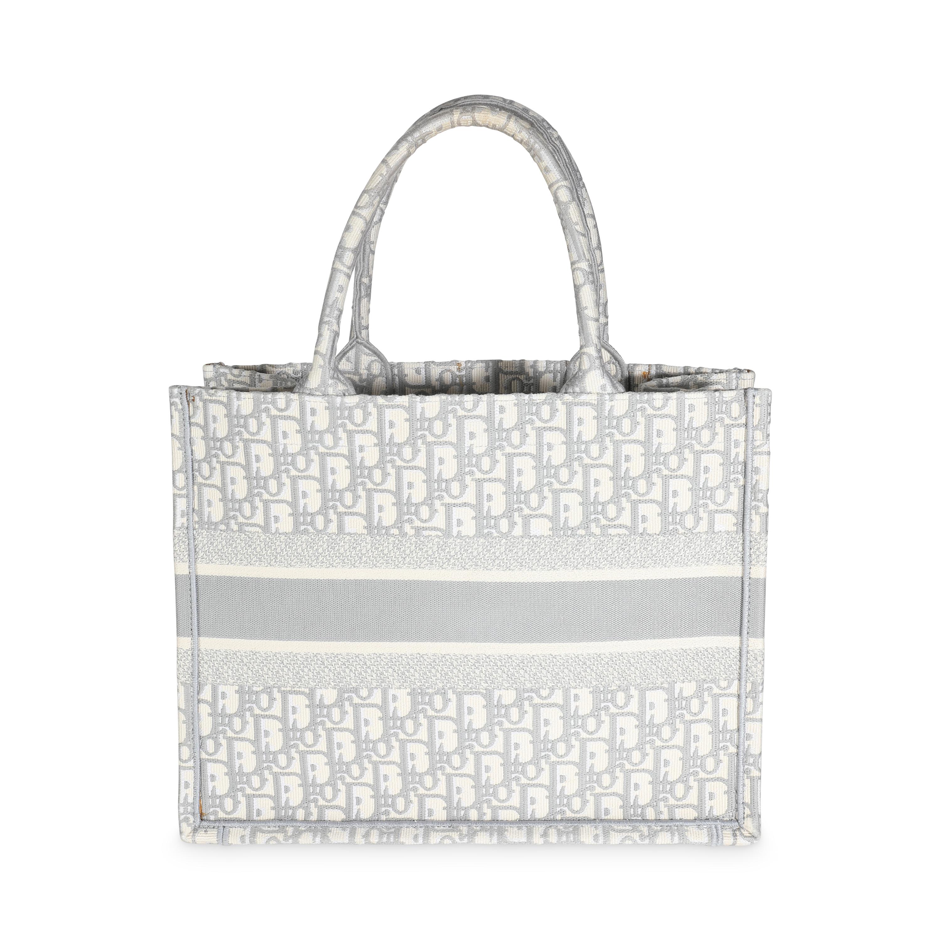 Listing Title: Christian Dior Grey Ecru Oblique Canvas Medium Book Tote
SKU: 141638
MSRP: 3350.00 USD
Condition: Pre-owned 
Condition Description: The Dior Book tote combines practicality with impeccable style. Embroidered throughout for a look