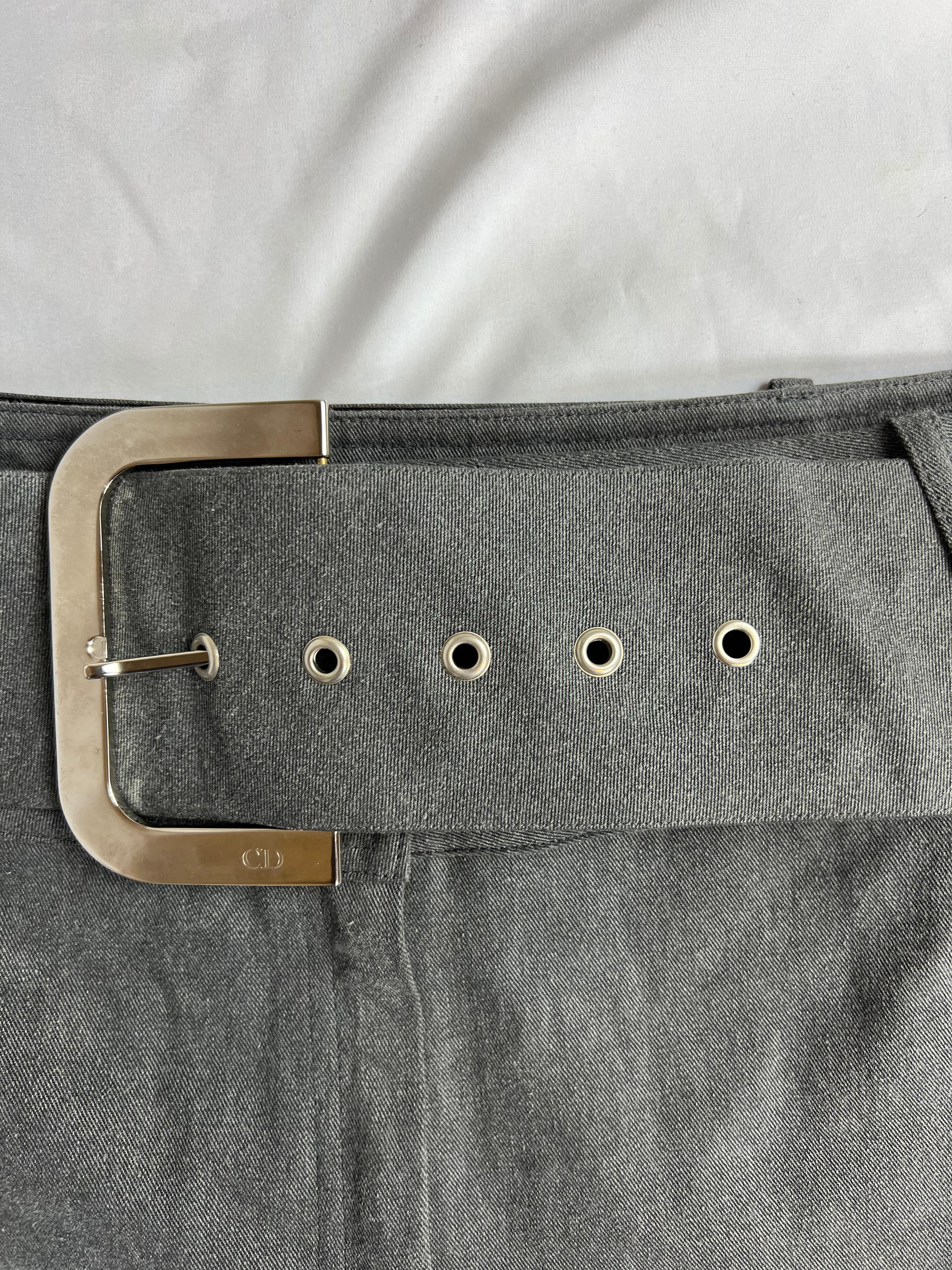 Christian Dior Grey Jeans Pants, Size 10

- Light grey denim wash
- 100% cotton
- Mid raise
- Flare fit
- Side slits
- Wide belt detail
- Silver tone hardware
- Front buttons and zip closure
- Made in France